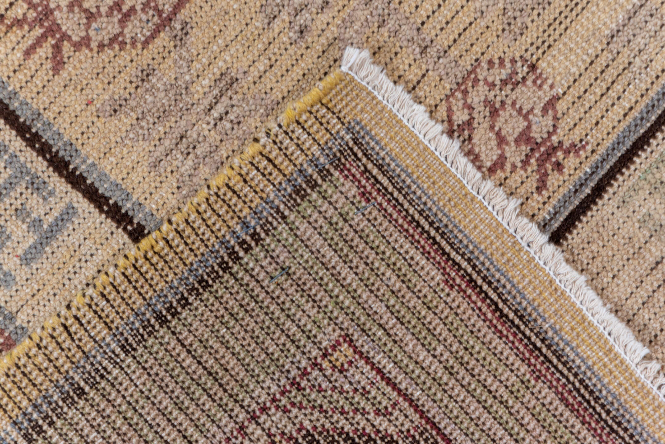 4' x 8' one-of-a-kind handmade vintage Khotan rug. Color palette: brown, gray, off-white, orange, pink