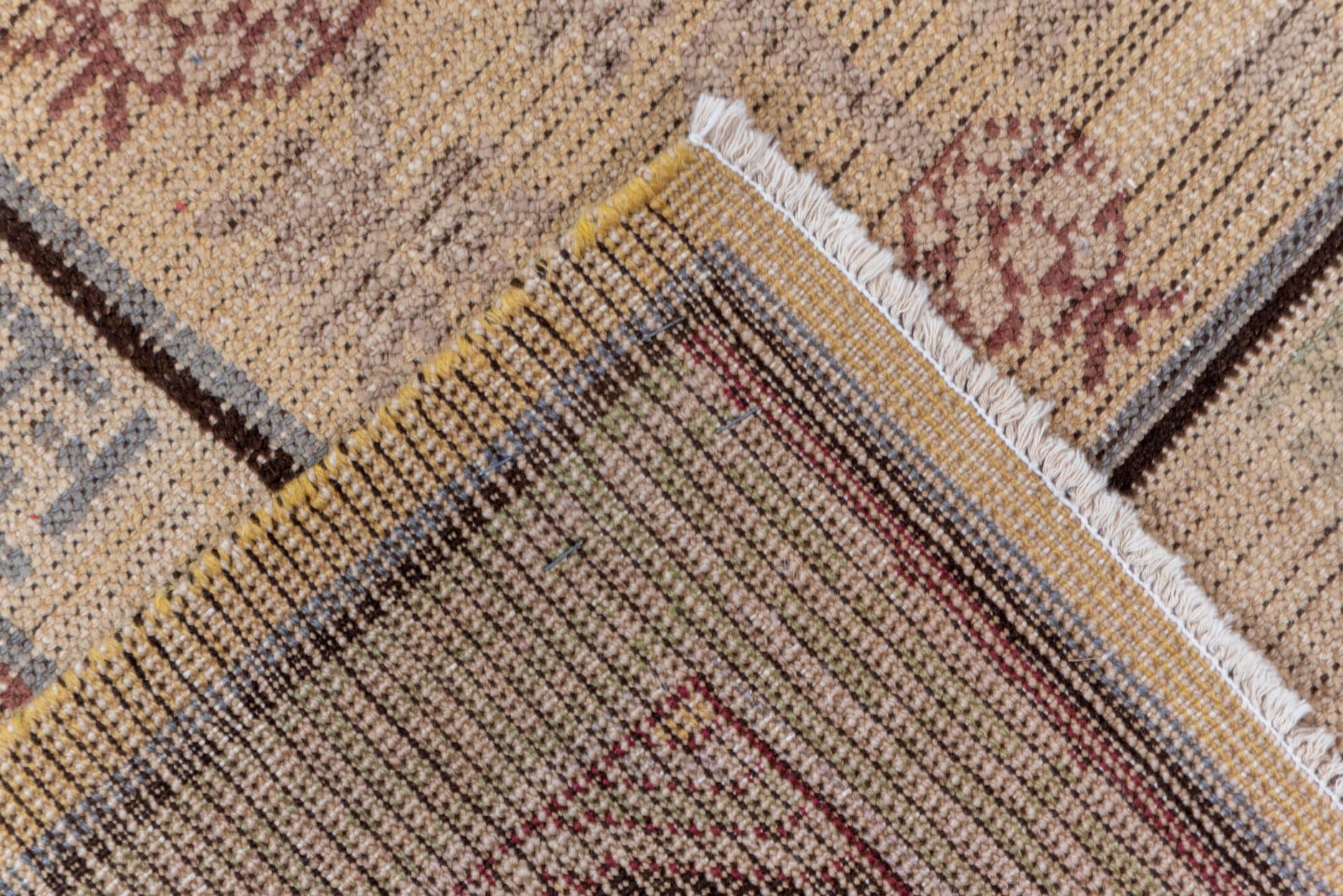 4' x 8' one-of-a-kind handmade vintage Khotan rug. Color palette: ivory, taupe, brown, camel, rose, slate, beige, gray, pink