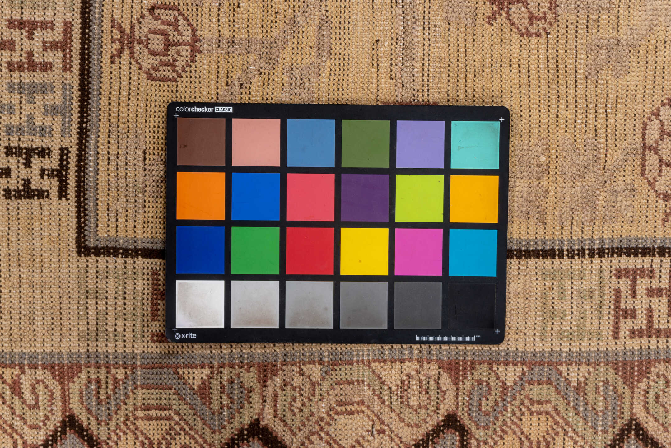 4' x 8' one-of-a-kind handmade vintage Khotan rug. Color palette: brown, gray, off-white, orange, pink