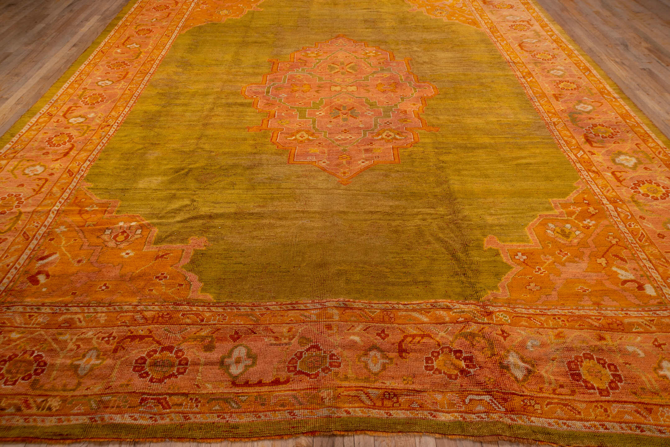 11' x 14' one-of-a-kind handmade antique Oushak oversize rug. Color palette: gold, blush, coral, saffron, terra cotta, ivory