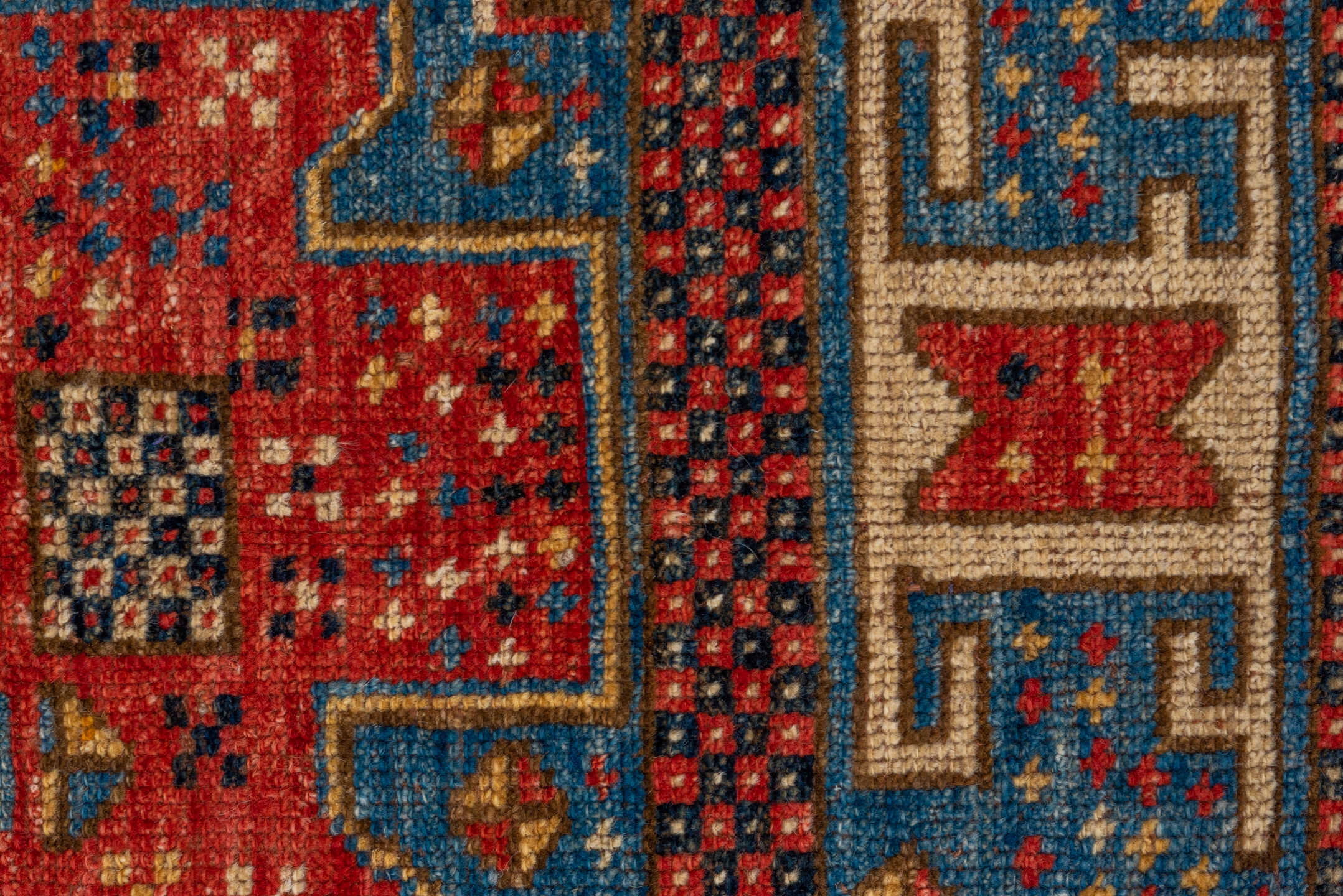 4' x 6' one-of-a-kind handmade vintage Kazak small size rug. Color palette: blue, ivory, red, camel, navy, brown, black