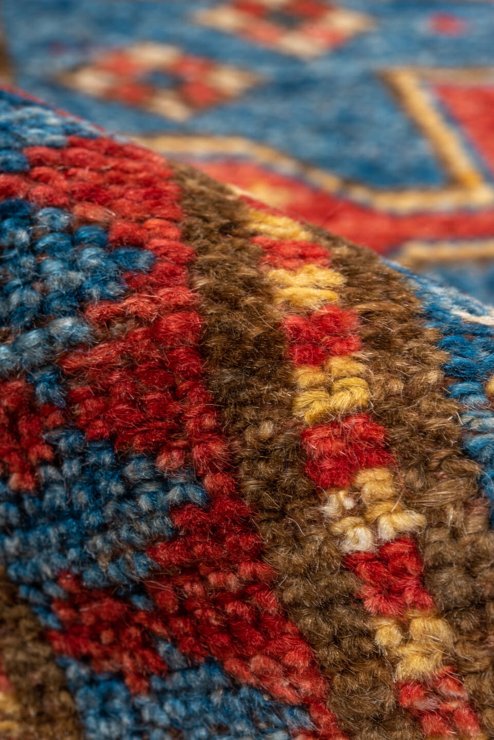 4' x 6' one-of-a-kind handmade vintage Kazak small size rug. Color palette: blue, ivory, red, camel, navy, brown, black