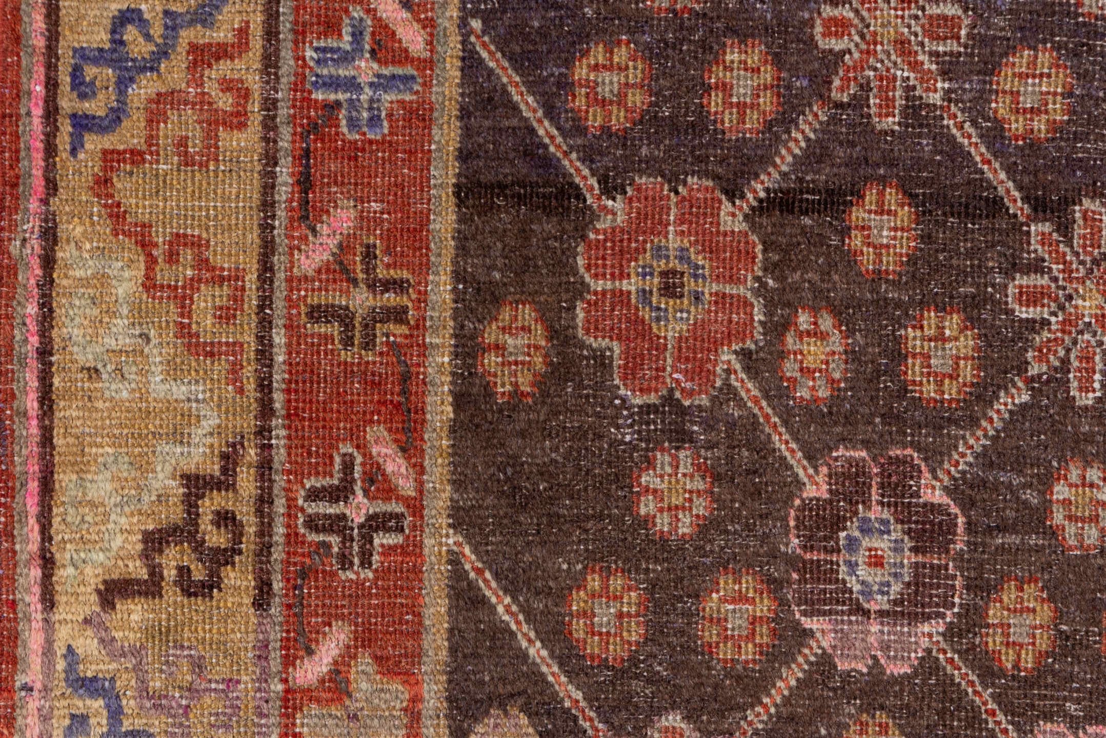 4' x 8' one-of-a-kind handmade vintage Khotan rug. Color palette: brown, pink, redwood