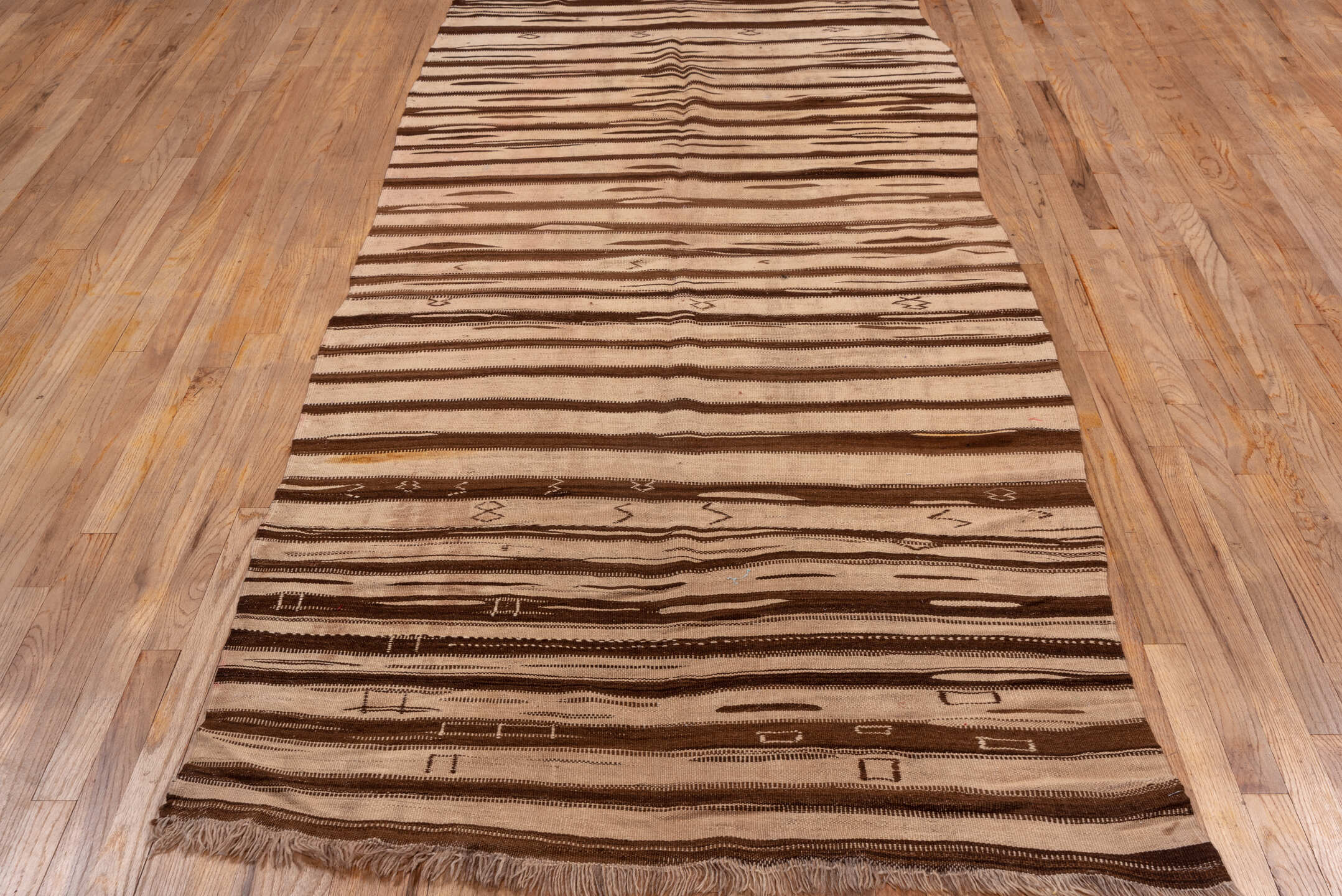 4' x 9' one-of-a-kind handmade vintage Kilim runner rug. Color palette: tan, brown, camel, taupe, ivory, beige, gray