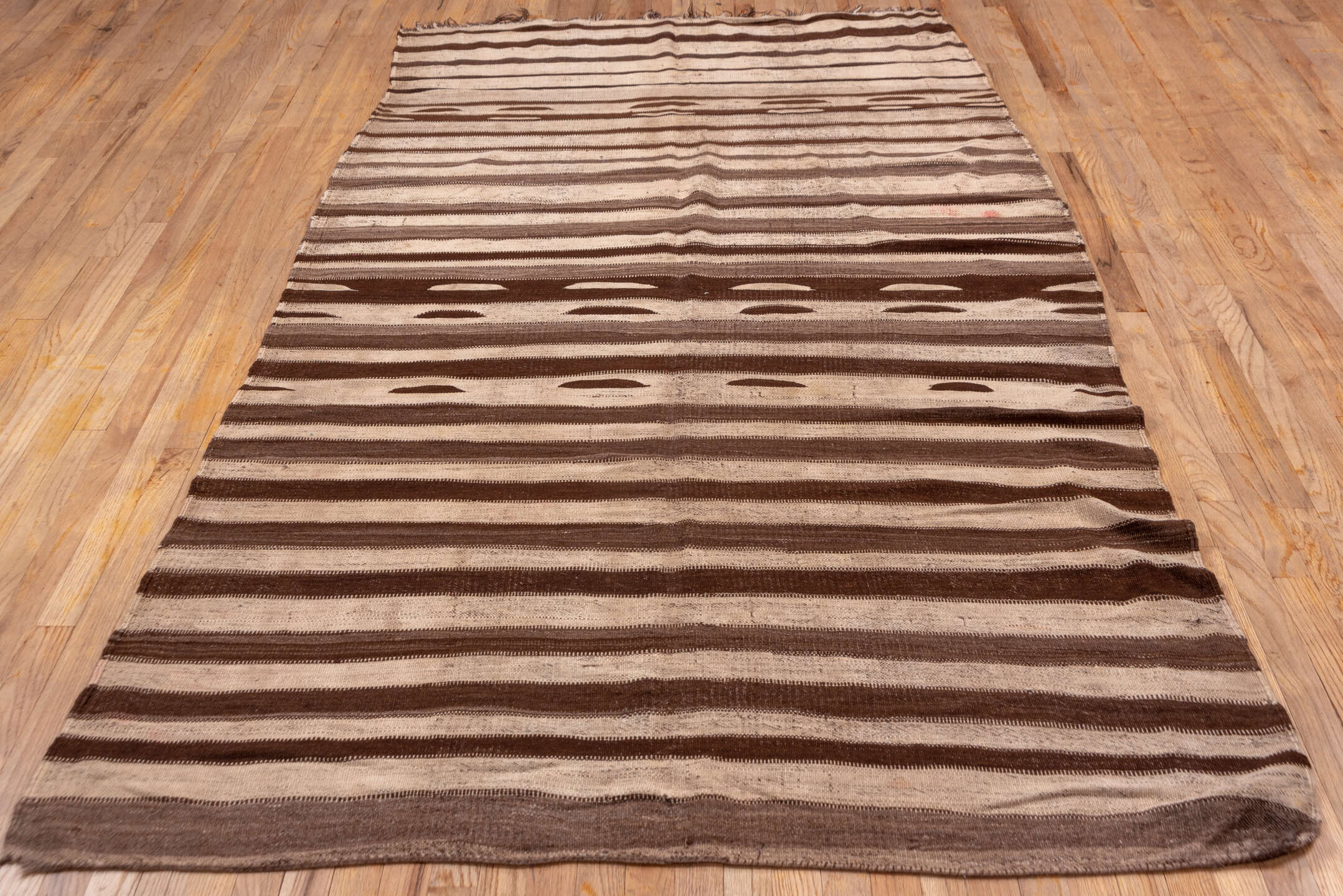 5' x 11' one-of-a-kind handmade vintage Kilim runner rug. Color palette: brown, beige, taupe, camel, ivory, gray