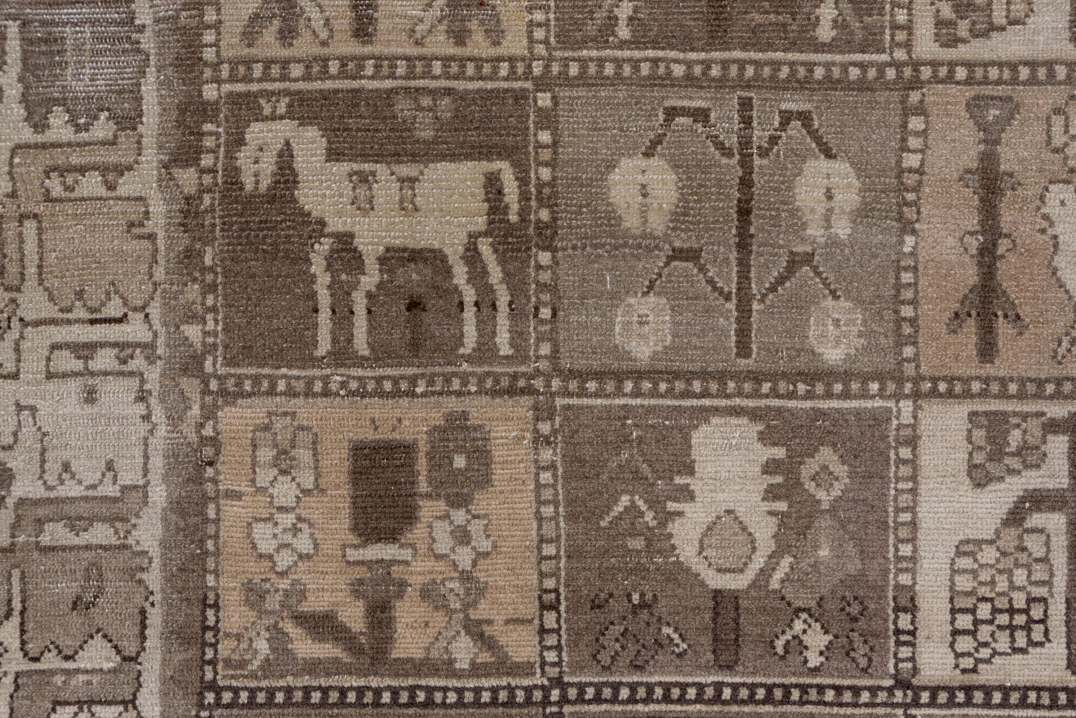 5' x 9' one-of-a-kind handmade antique Baktiary medium size rug. Color palette: taupe, brown, ivory, charcoal, camel, beige