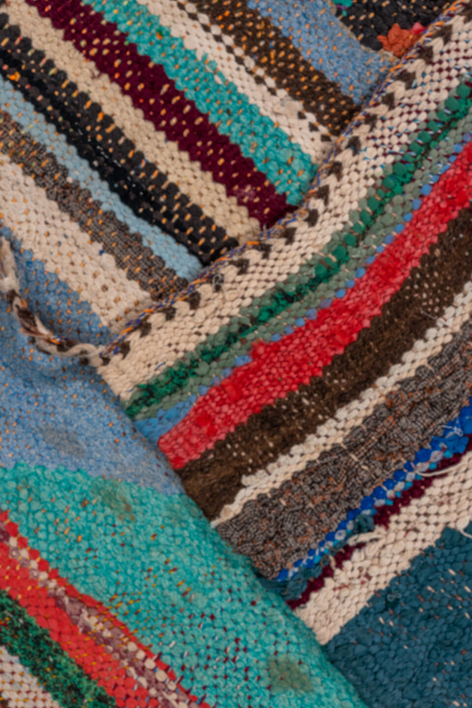 4' x 5' one-of-a-kind handmade vintage Rag Rug small size rug. Color palette: ivory, turquoise, charcoal, coral, burgundy
