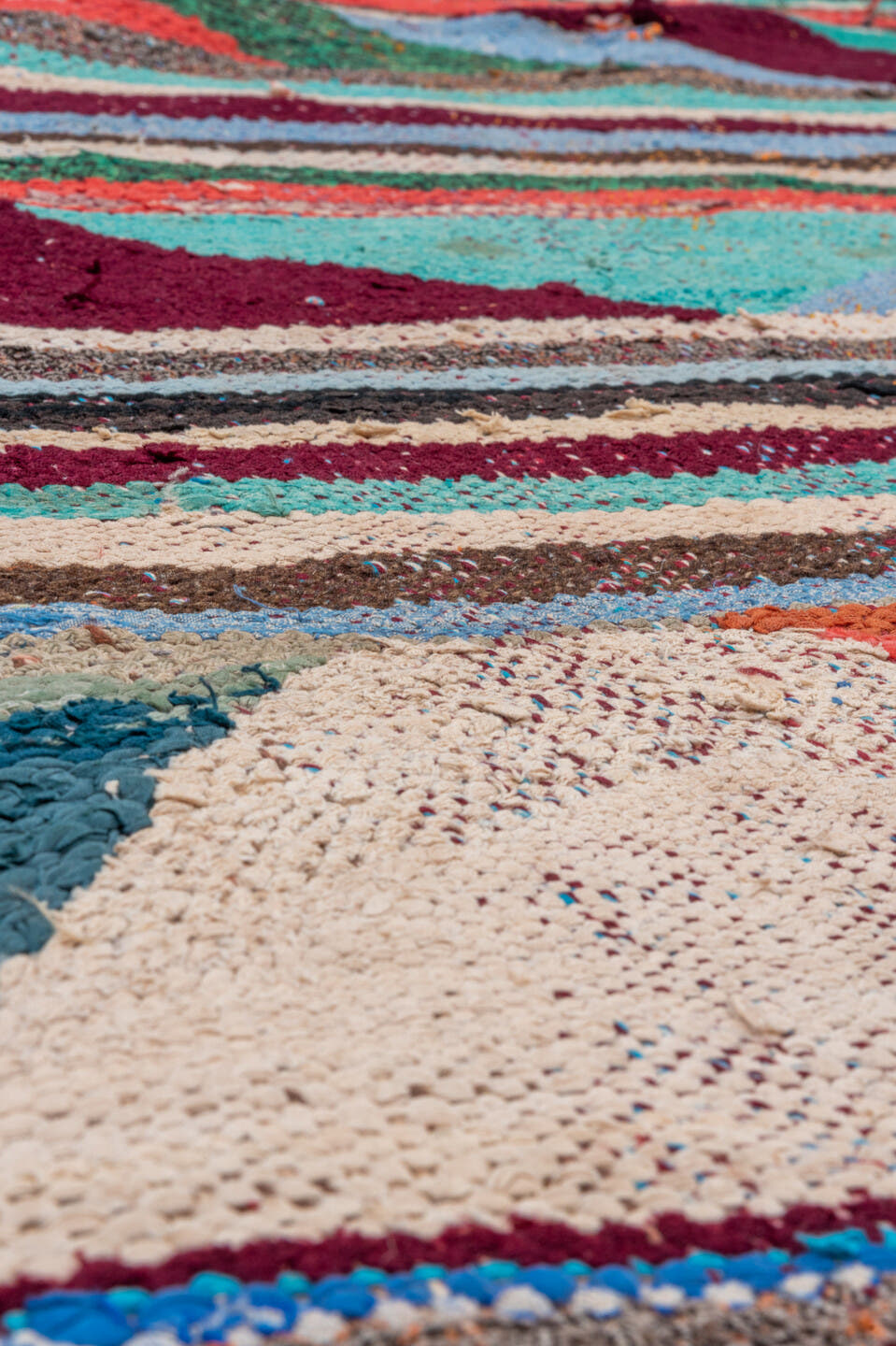 4' x 5' one-of-a-kind handmade vintage Rag Rug small size rug. Color palette: ivory, turquoise, charcoal, coral, burgundy
