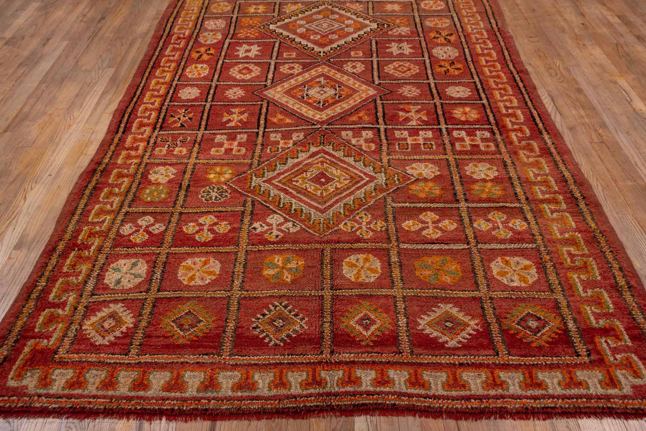 6' x 10' one-of-a-kind handmade vintage Moroccan large size rug. Color palette: terra cotta, rust, rose, ivory, gold, sienna