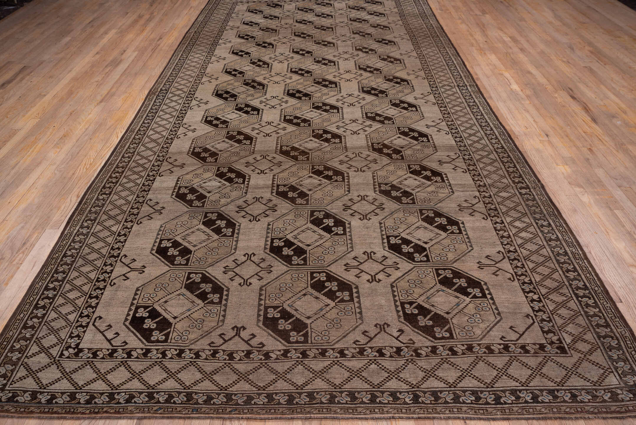 7' x 15' one-of-a-kind handmade antique Afghan rug. Color palette: taupe, brown, camel, ivory, charcoal, beige, gray, black