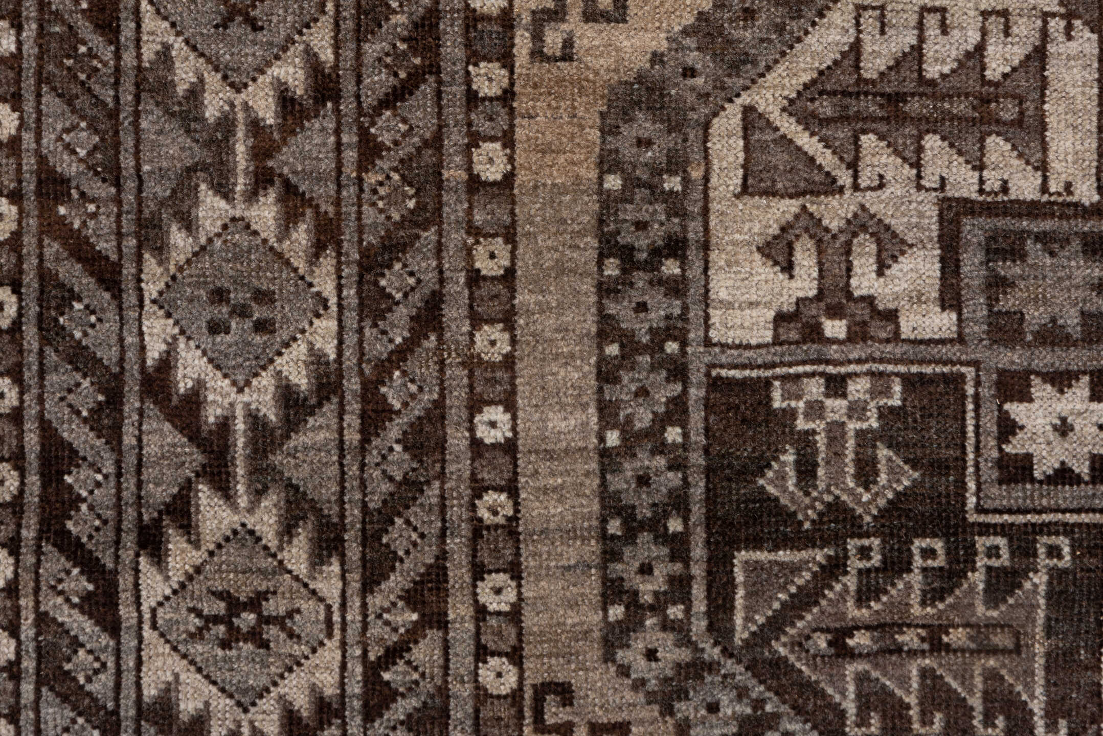 7' x 9' one-of-a-kind handmade antique Afghan rug. Color palette: brown, taupe, ivory, charcoal, camel, slate, beige, gray