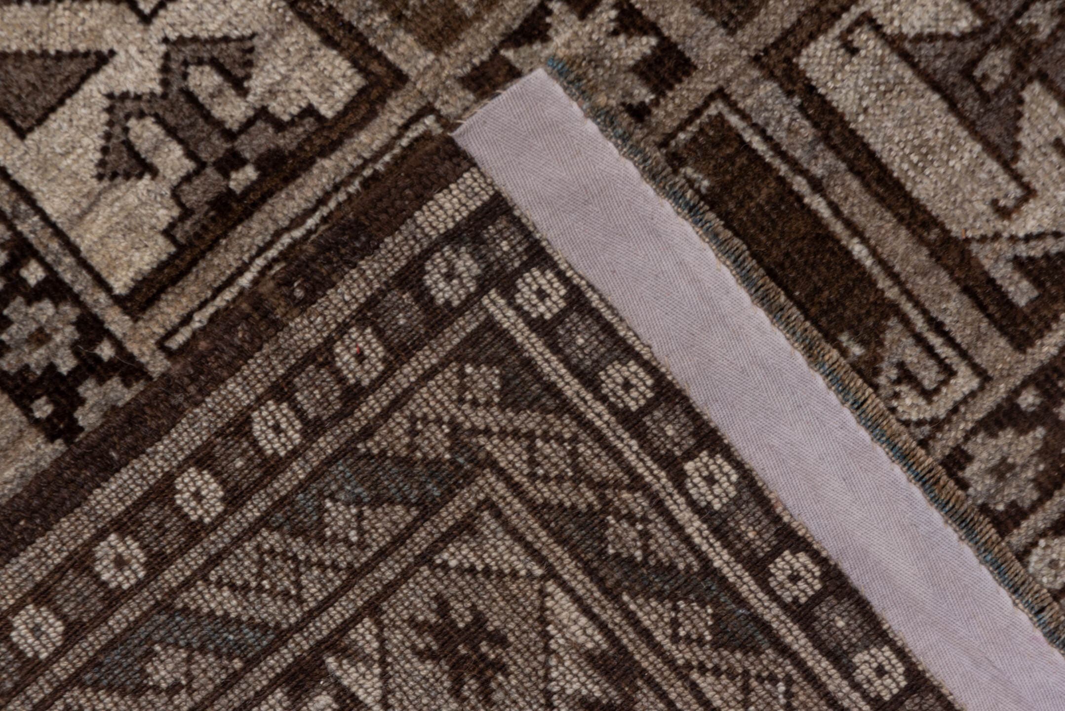 7' x 9' one-of-a-kind handmade antique Afghan rug. Color palette: brown, taupe, ivory, charcoal, camel, slate, beige, gray