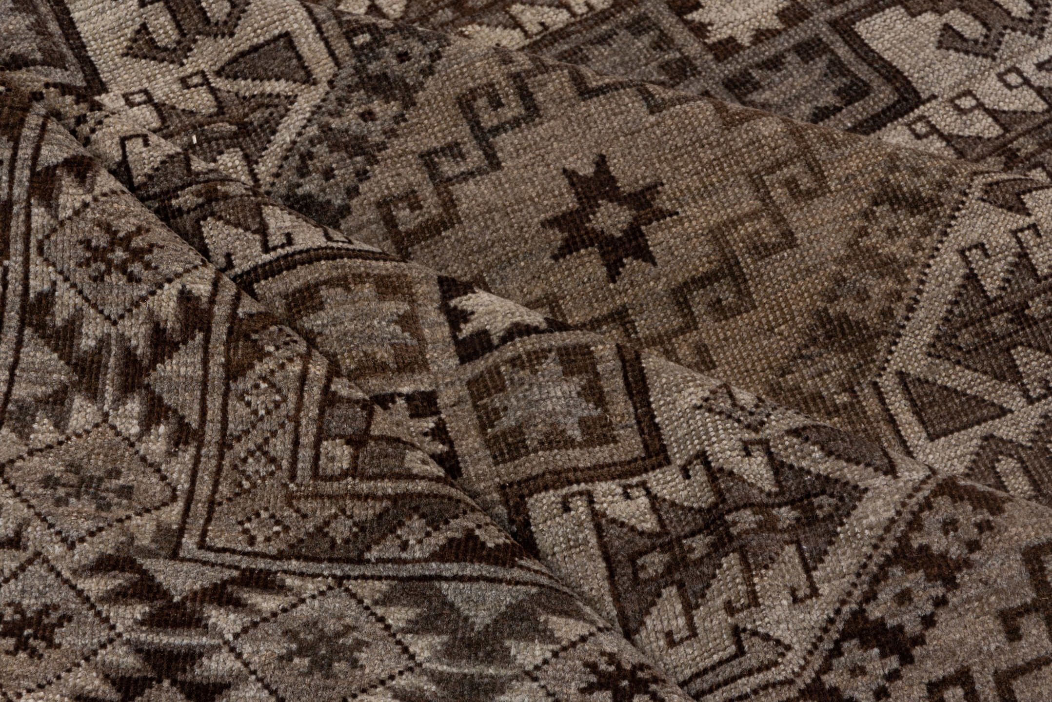 7' x 9' one-of-a-kind handmade antique Afghan rug. Color palette: brown, taupe, ivory, charcoal, camel, slate, beige, gray