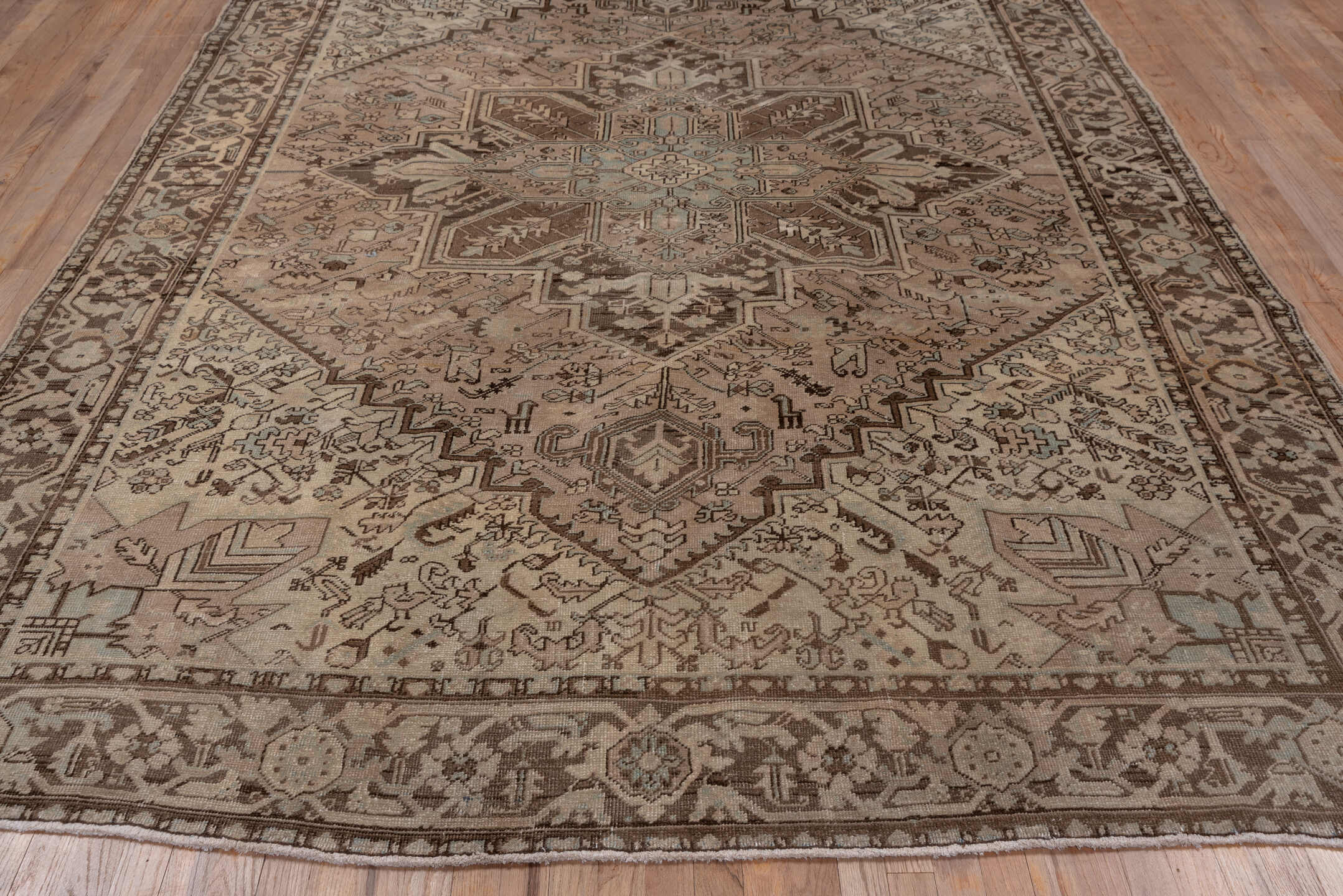 8' x 10' one-of-a-kind handmade antique Heriz large size rug. Color palette: taupe, brown, ivory, pale blue, camel, charcoal