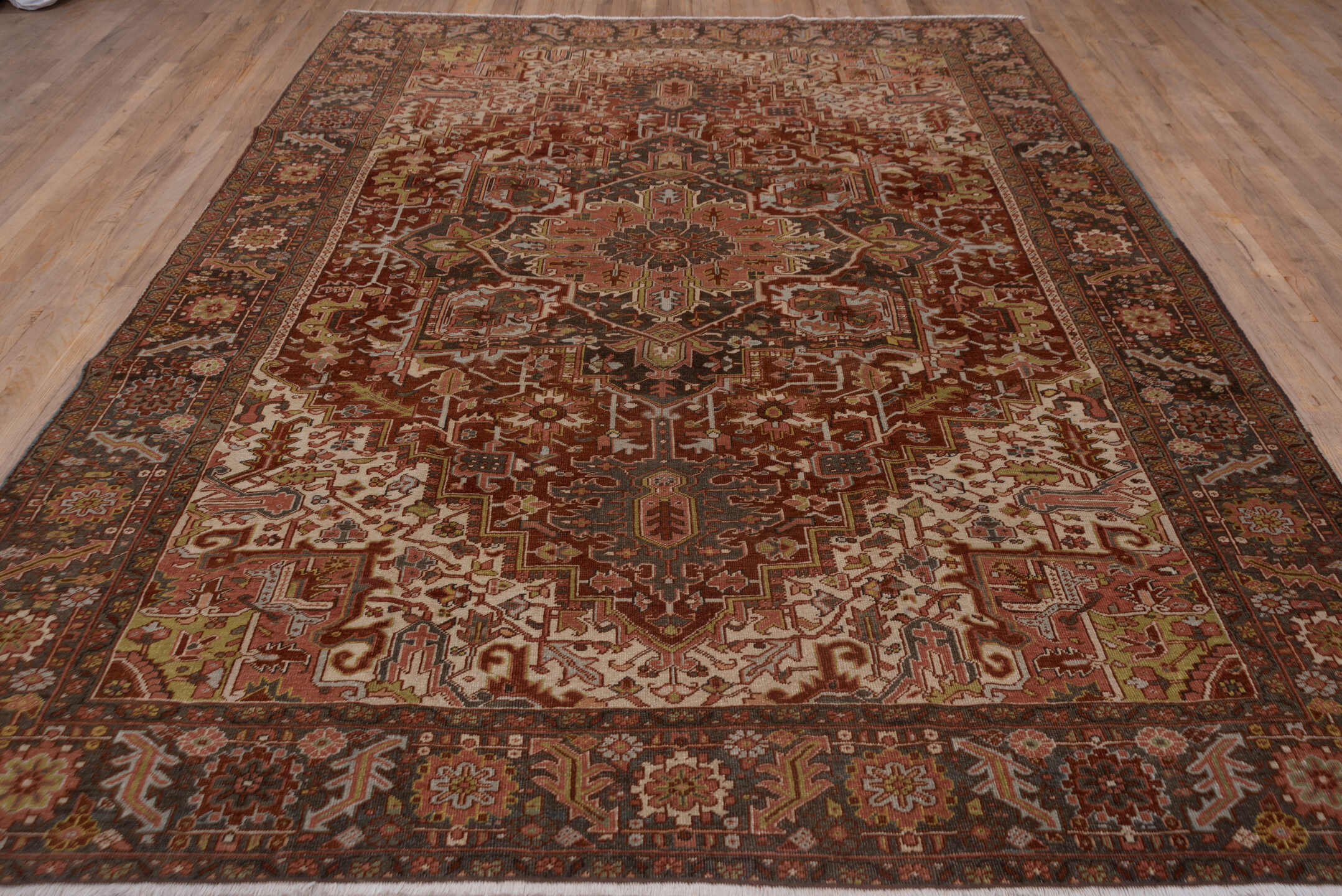 8' x 11' one-of-a-kind handmade antique Heriz large size rug. Color palette: rust, ivory, charcoal, terra cotta, olive