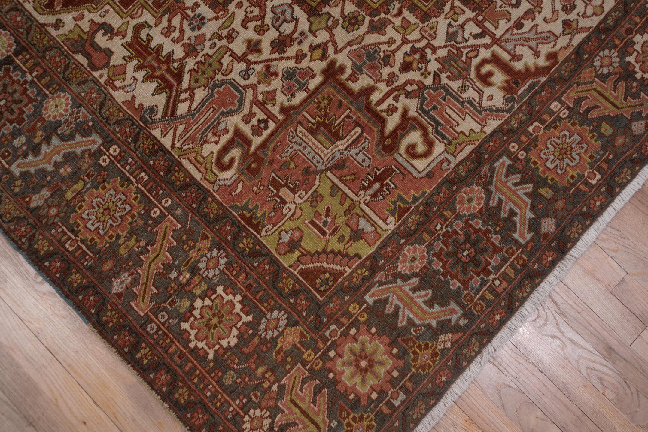 8' x 11' one-of-a-kind handmade antique Heriz large size rug. Color palette: rust, ivory, charcoal, terra cotta, olive