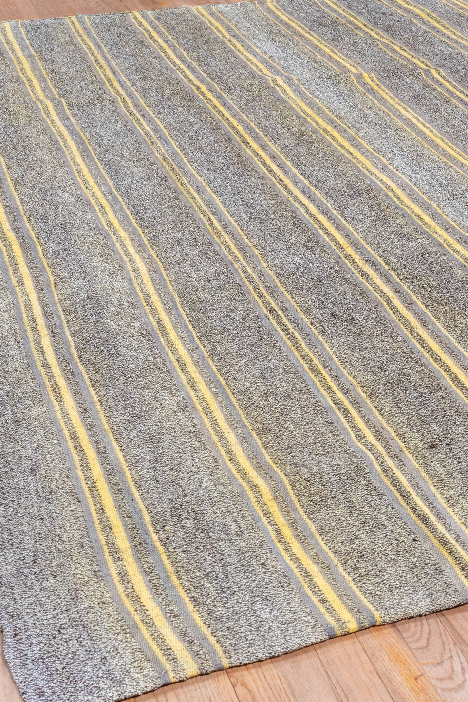 7' x 9' one-of-a-kind handmade antique Flatweave rug. Color palette: gray, ivory, gold, charcoal, black