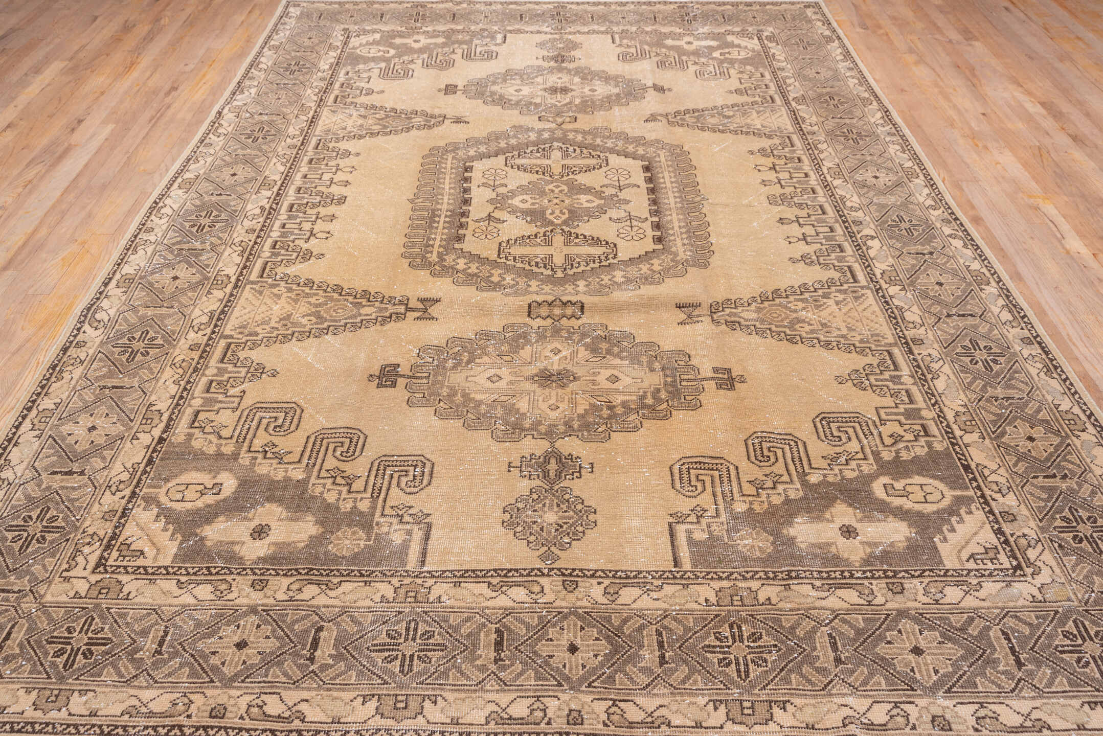 7' x 12' one-of-a-kind handmade antique Veece large size rug. Color palette: taupe, beige, brown, ivory, camel, charcoal