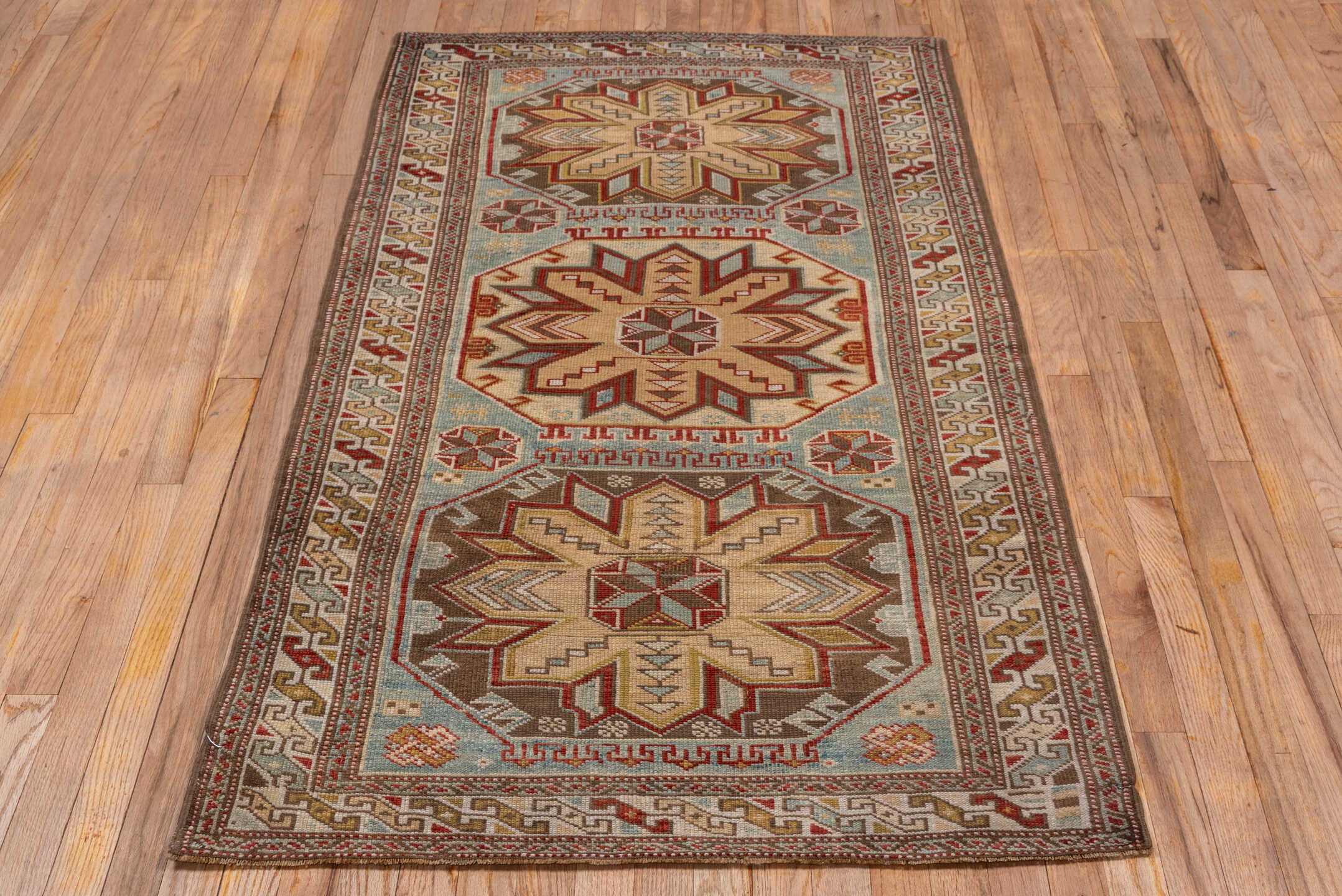 3' x 5' one-of-a-kind handmade antique Shirvan small size rug. Color palette: ivory, pale blue, rust, brown, camel, taupe