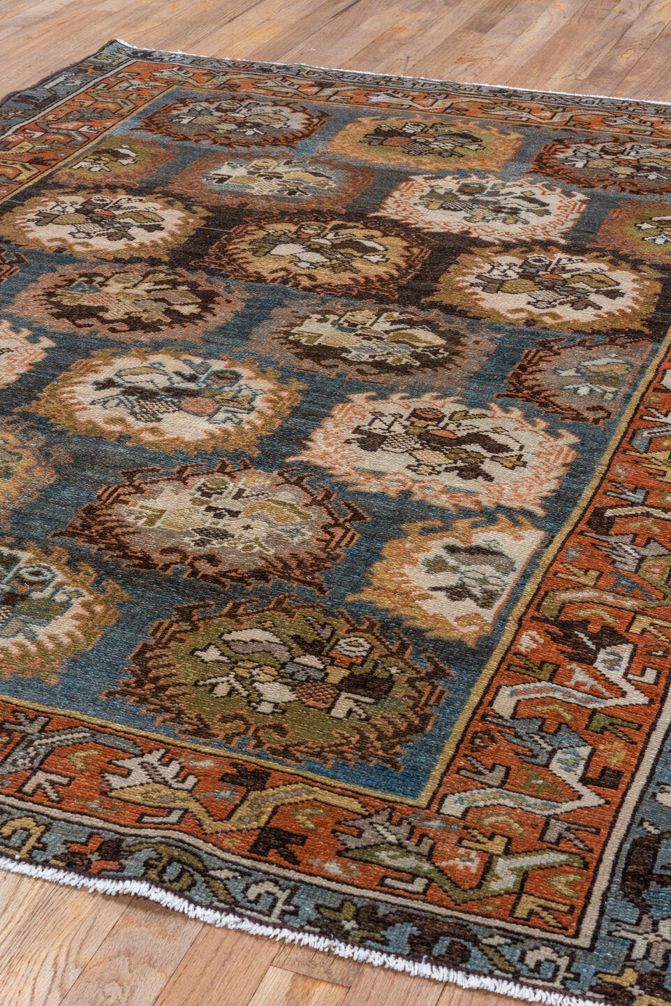 4' x 6' one-of-a-kind handmade antique Baktiary rug. Color palette: sky blue, rust, ivory, brown, camel, slate, taupe, olive