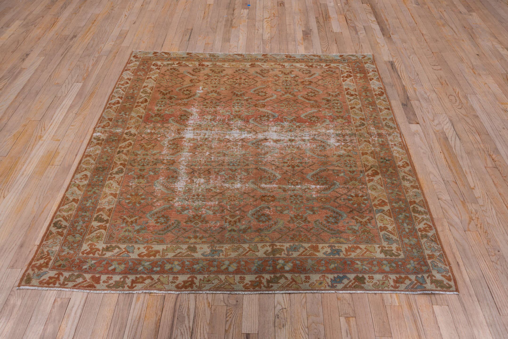 5' x 6' one-of-a-kind handmade antique Malayer rug. Color palette: terra cotta, rust, ivory, sage, camel, brown, pale blue