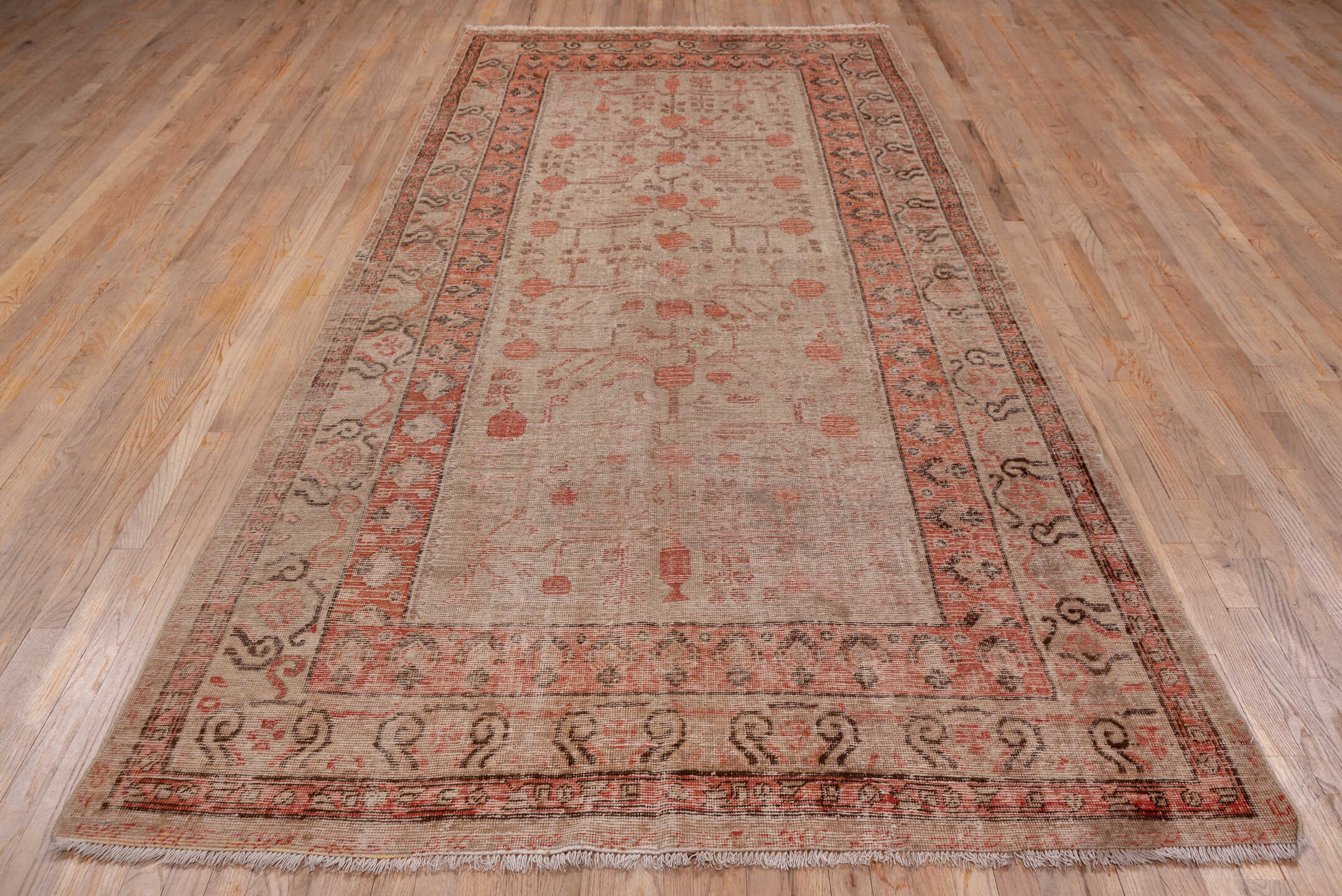 5' x 11' one-of-a-kind handmade antique Khotan rug. Color palette: ivory, terra cotta, taupe, charcoal, rose, camel