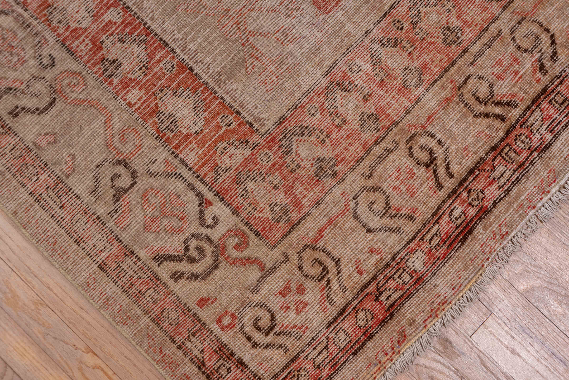 5' x 11' one-of-a-kind handmade antique Khotan rug. Color palette: ivory, terra cotta, taupe, charcoal, rose, camel