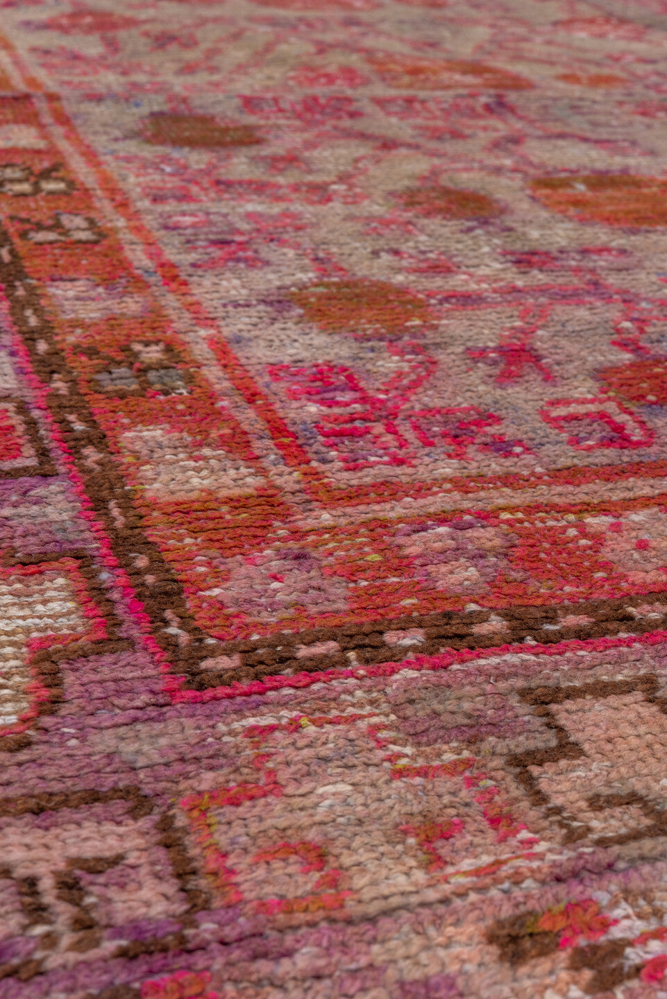 5' x 9' one-of-a-kind handmade vintage Khotan medium size rug. Color palette: brown, pink, red, rosy brown