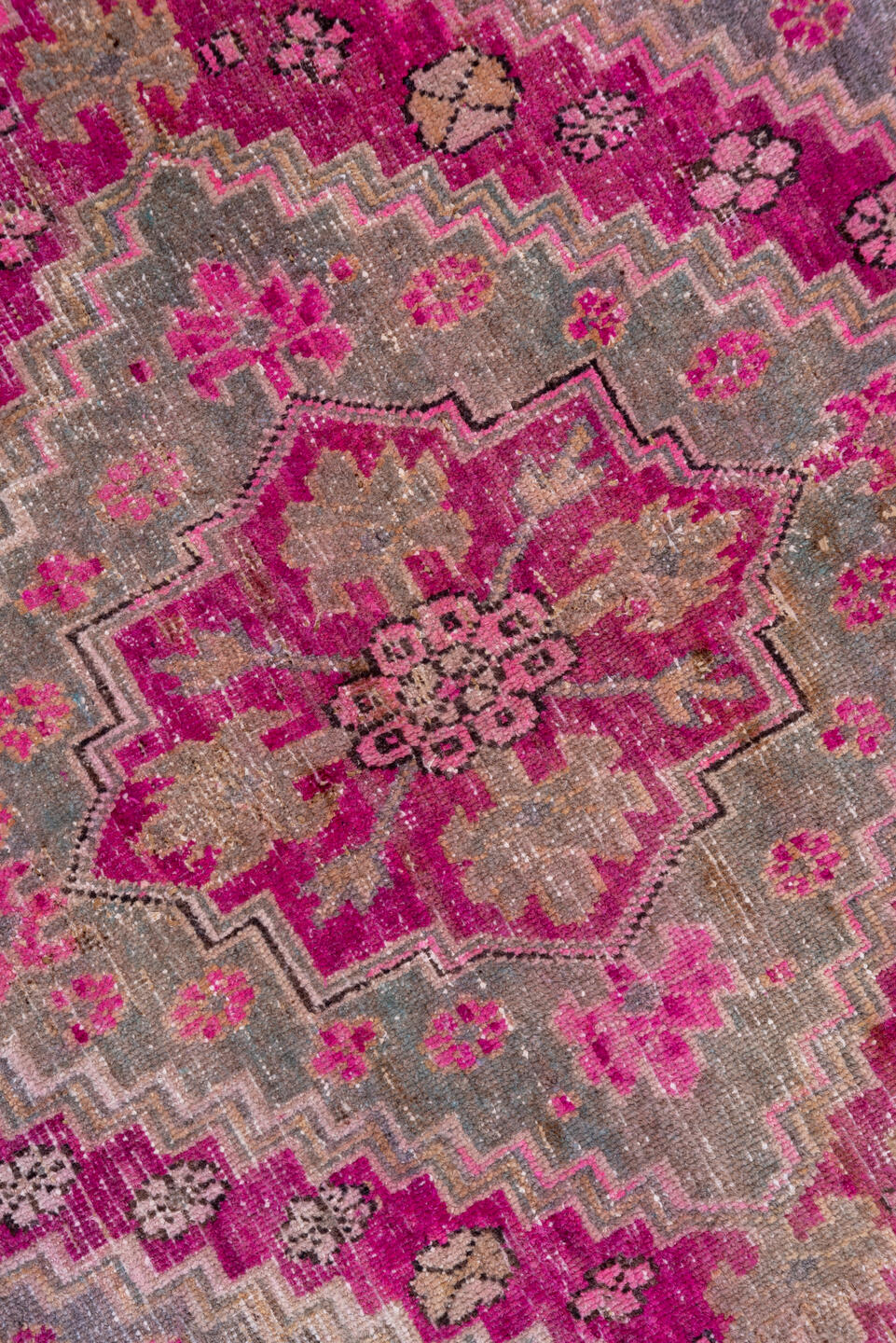 4' x 8' one-of-a-kind handmade vintage Khotan rug. Color palette: brown, gray, pink, red