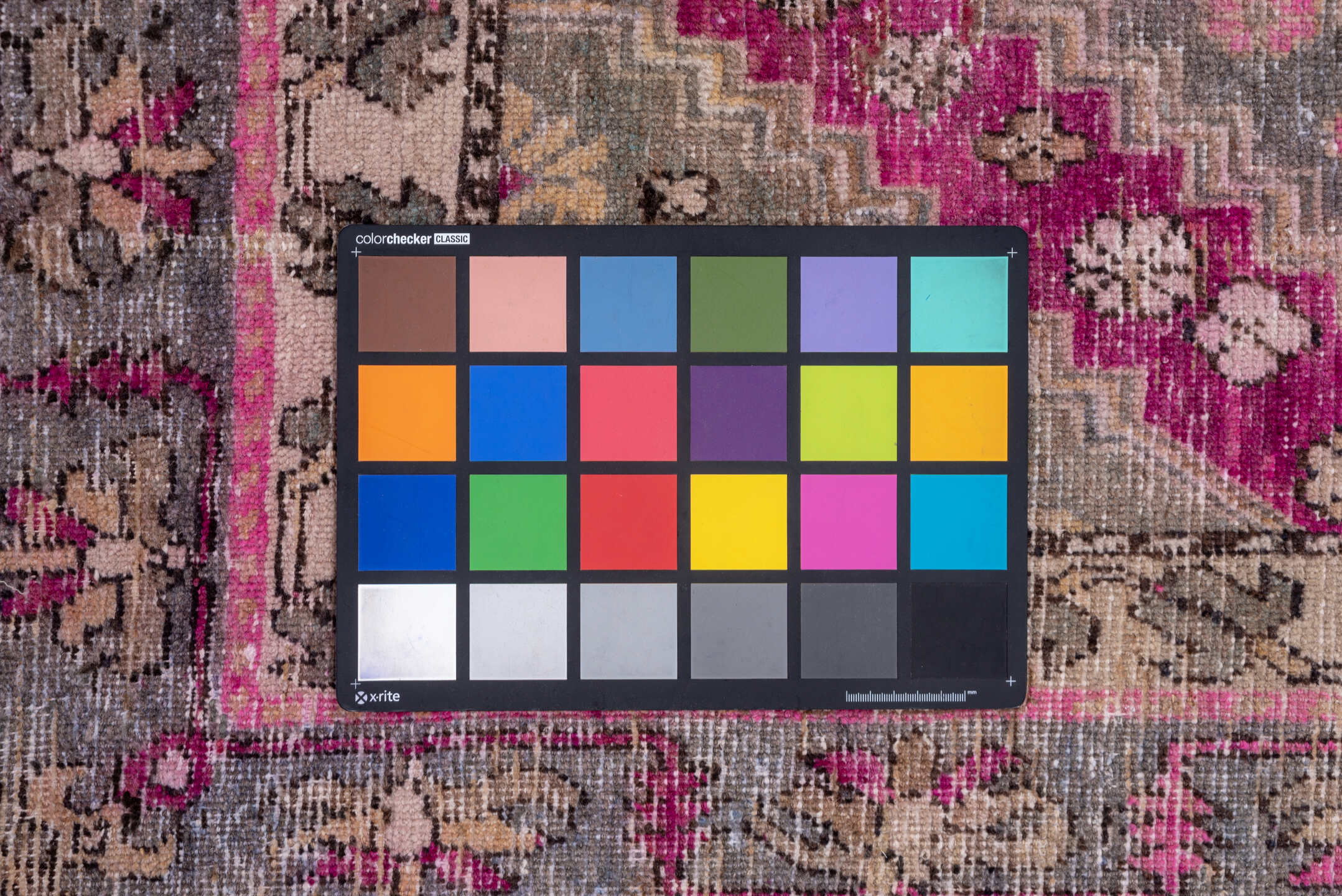 4' x 8' one-of-a-kind handmade vintage Khotan rug. Color palette: brown, gray, pink, red