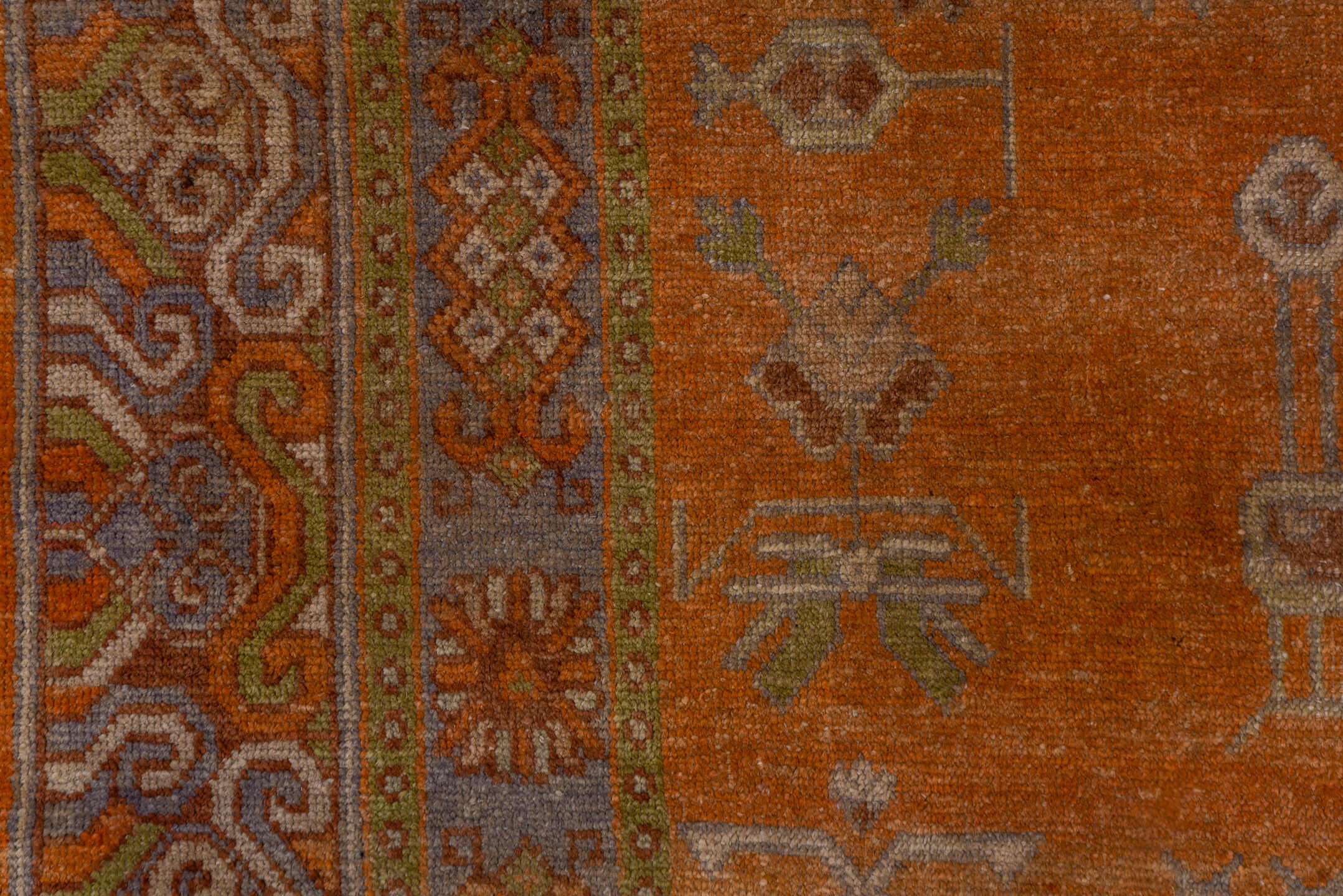 5' x 9' one-of-a-kind handmade antique Khotan medium size rug. Color palette: terra cotta, taupe, rust, camel, ivory, sienna