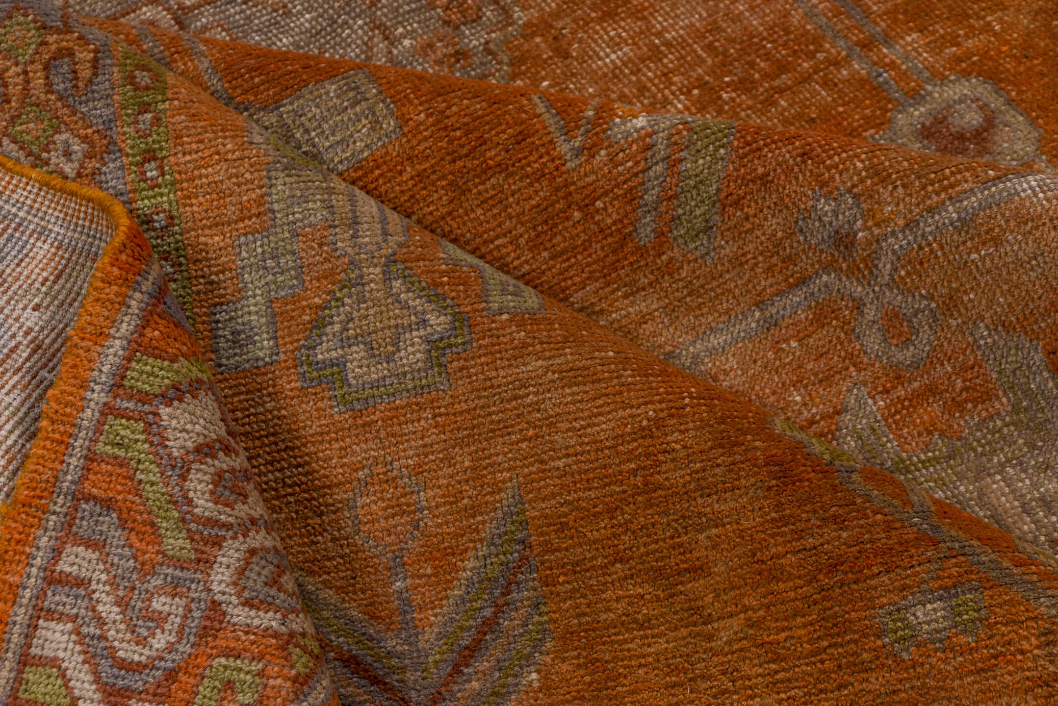 5' x 9' one-of-a-kind handmade vintage Khotan medium size rug. Color palette: brown, light gray, off-white, pink