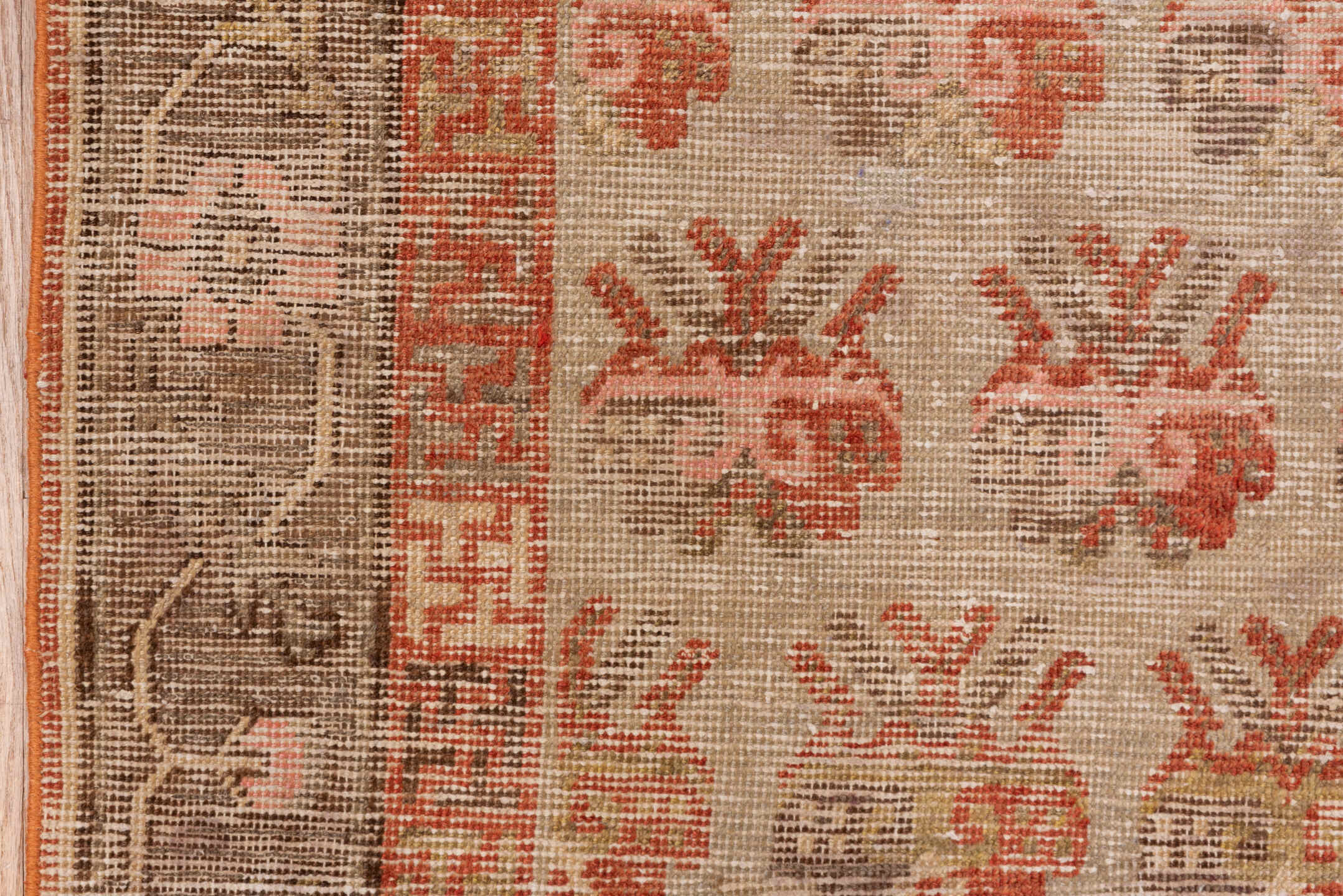 4' x 7' one-of-a-kind handmade vintage Khotan rug. Color palette: brown, off-white, orange, pink