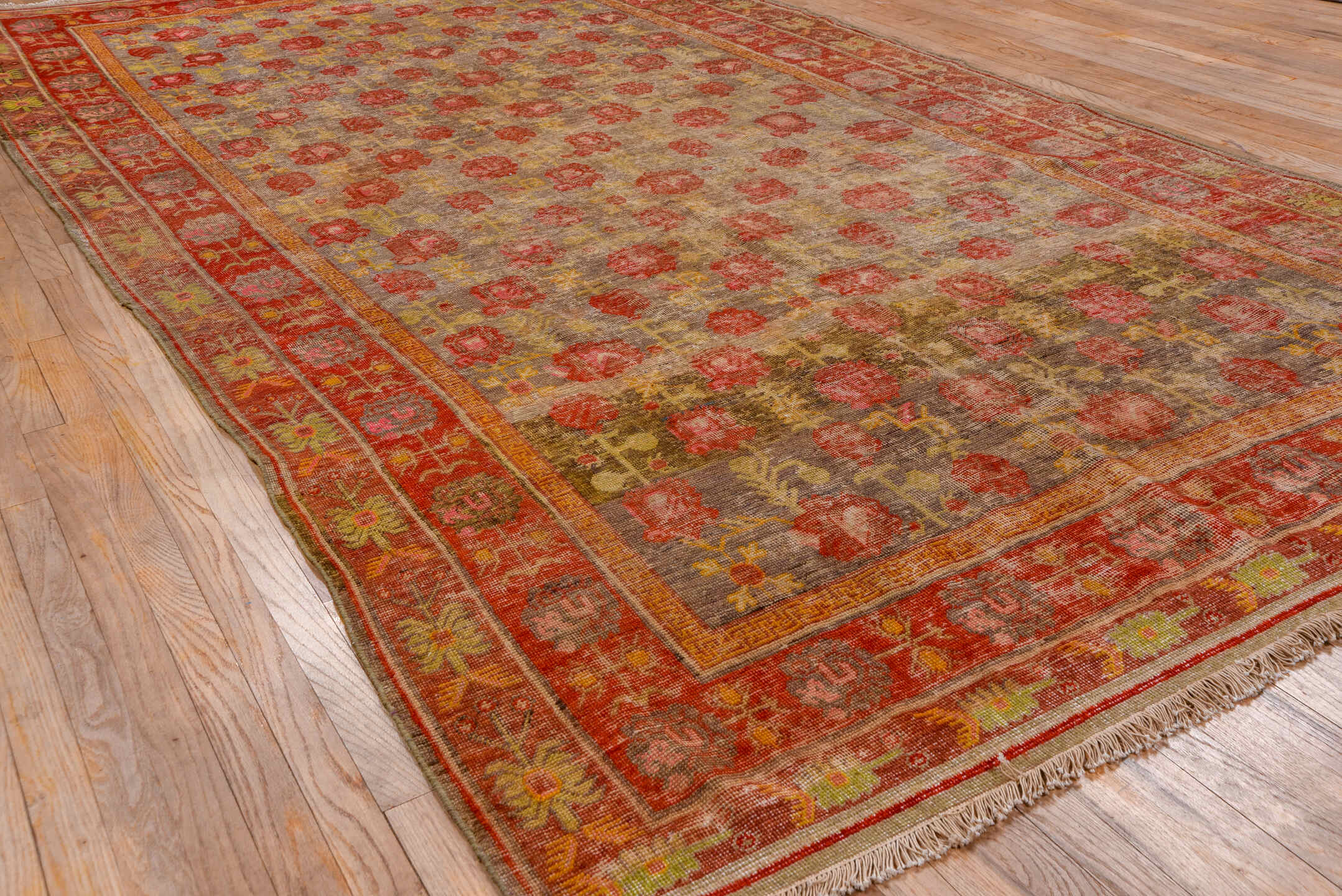 6' x 12' one-of-a-kind handmade antique Khotan large size rug. Color palette: taupe, rust, coral, terracotta, gold, rose