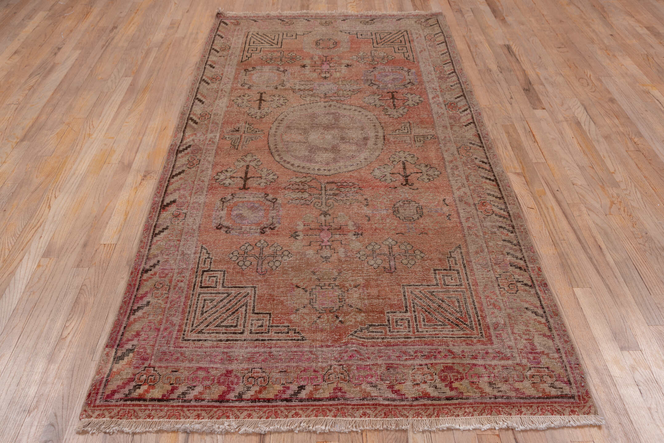 4' x 9' one-of-a-kind handmade vintage Khotan runner rug. Color palette: brown, gray, pink, red