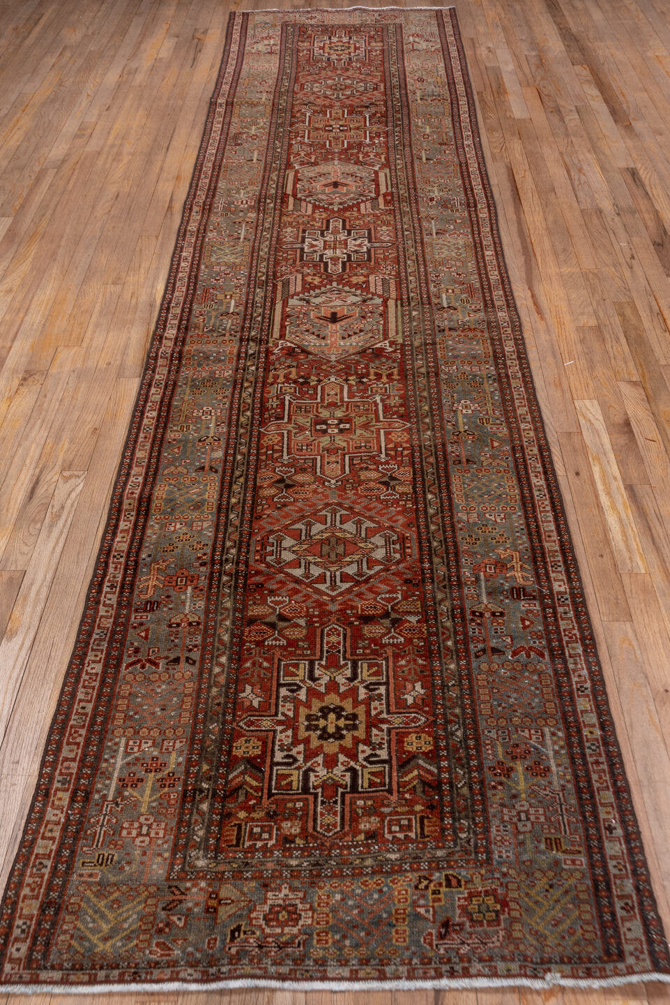 3' x 14' one-of-a-kind handmade antique Karaje runner rug. Color palette: rust, blue-gray, ivory, burgundy, taupe, camel