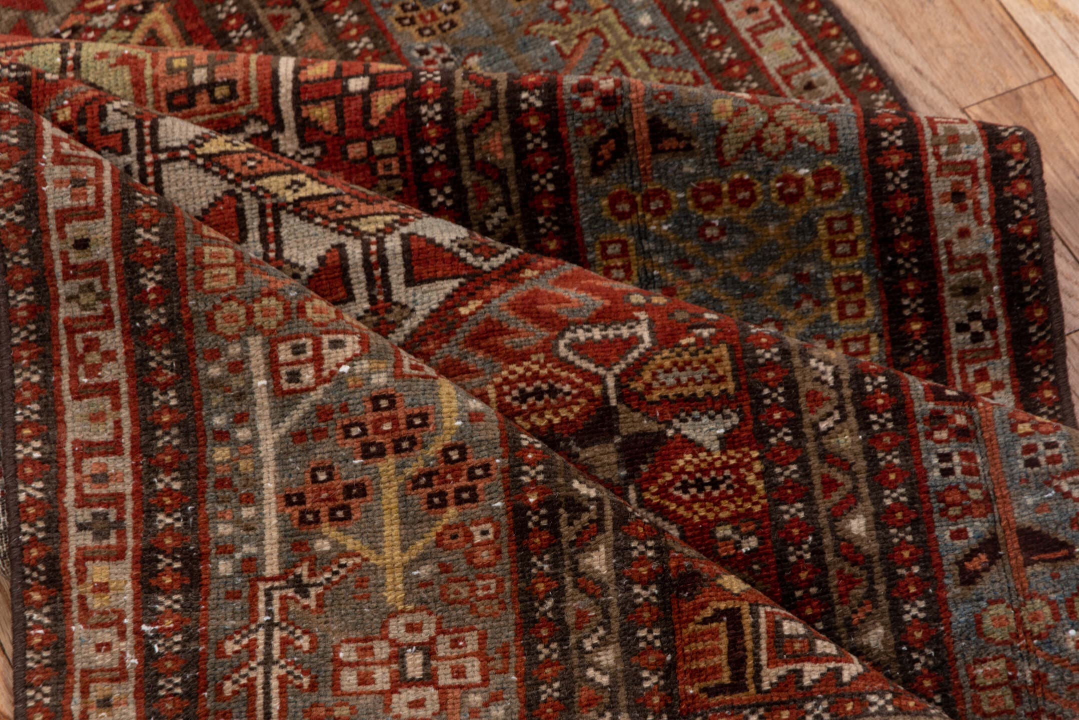 3' x 14' one-of-a-kind handmade antique Karaje runner rug. Color palette: rust, blue-gray, ivory, burgundy, taupe, camel