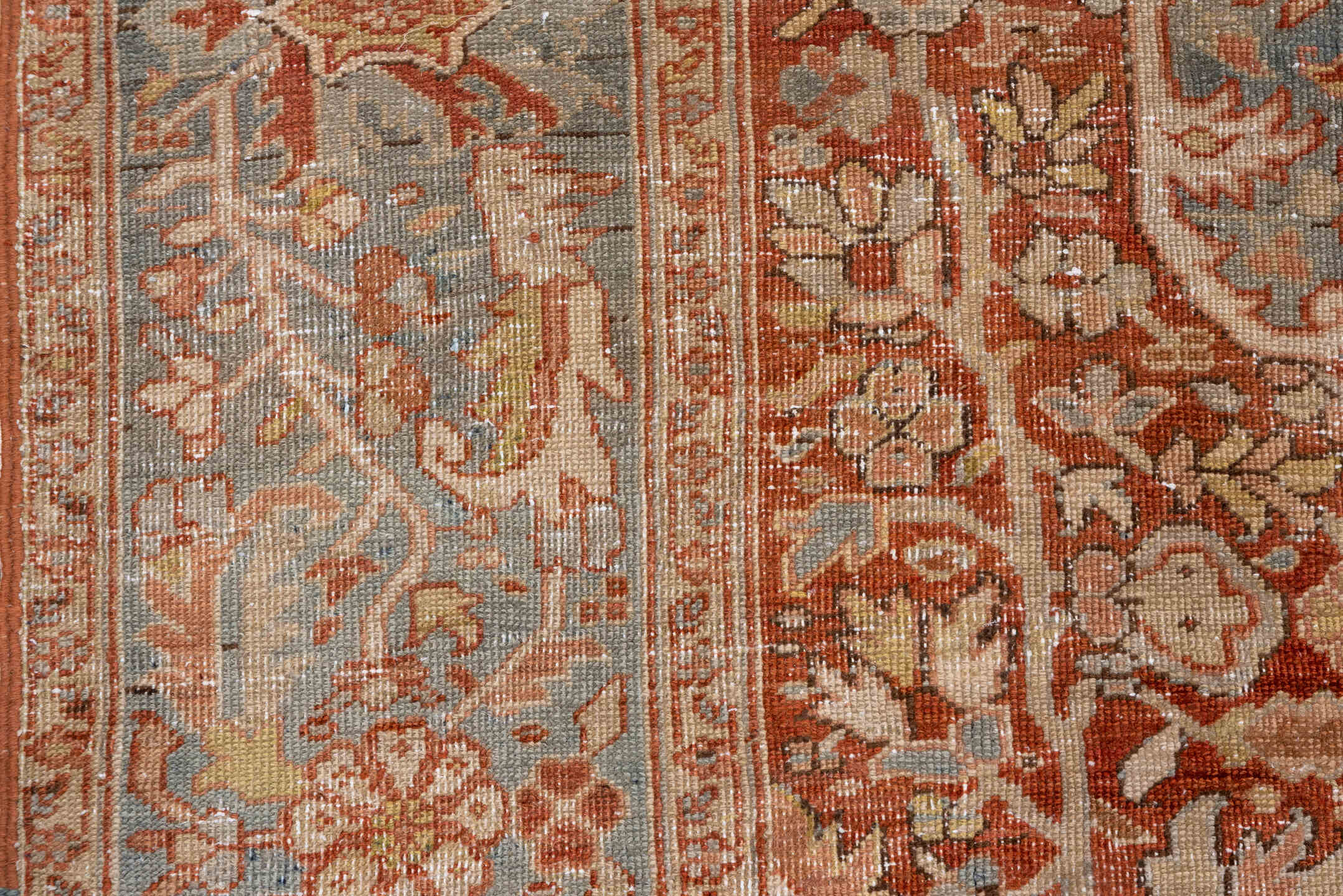 7' x 11' one-of-a-kind handmade antique Heriz large size rug. Color palette: terra cotta, light blue, ivory, rust, sage