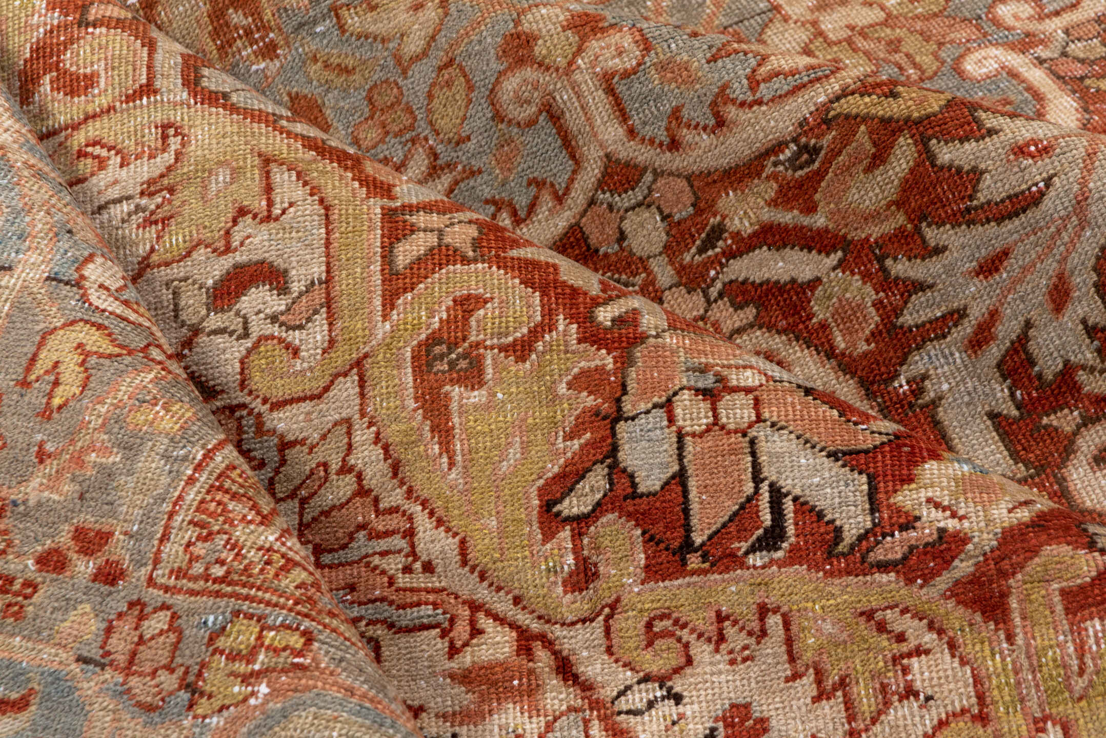 7' x 11' one-of-a-kind handmade antique Heriz large size rug. Color palette: terra cotta, light blue, ivory, rust, sage