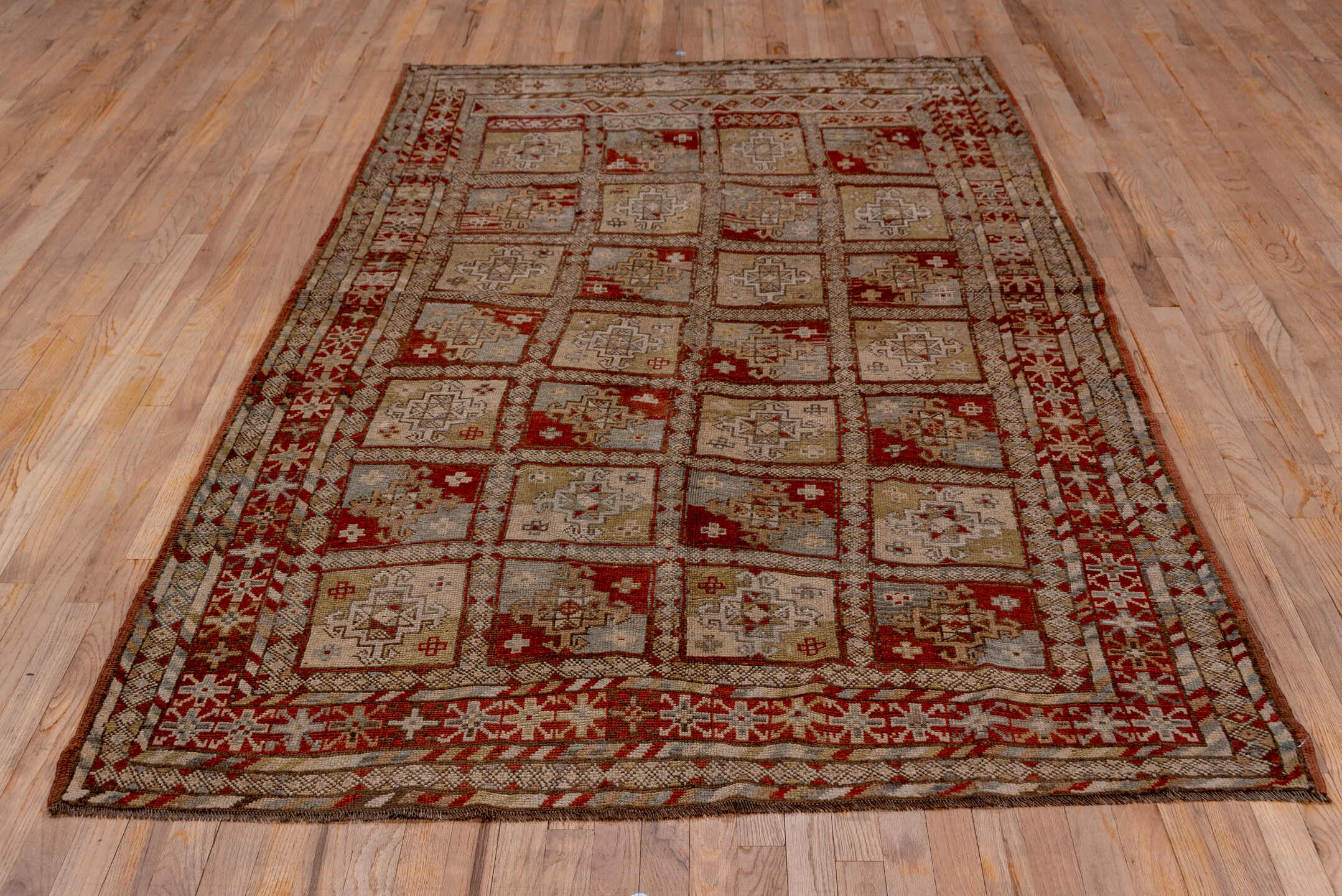 5' x 9' one-of-a-kind handmade antique NW Persian medium size rug. Color palette: taupe, rust, ivory, slate, brown, camel