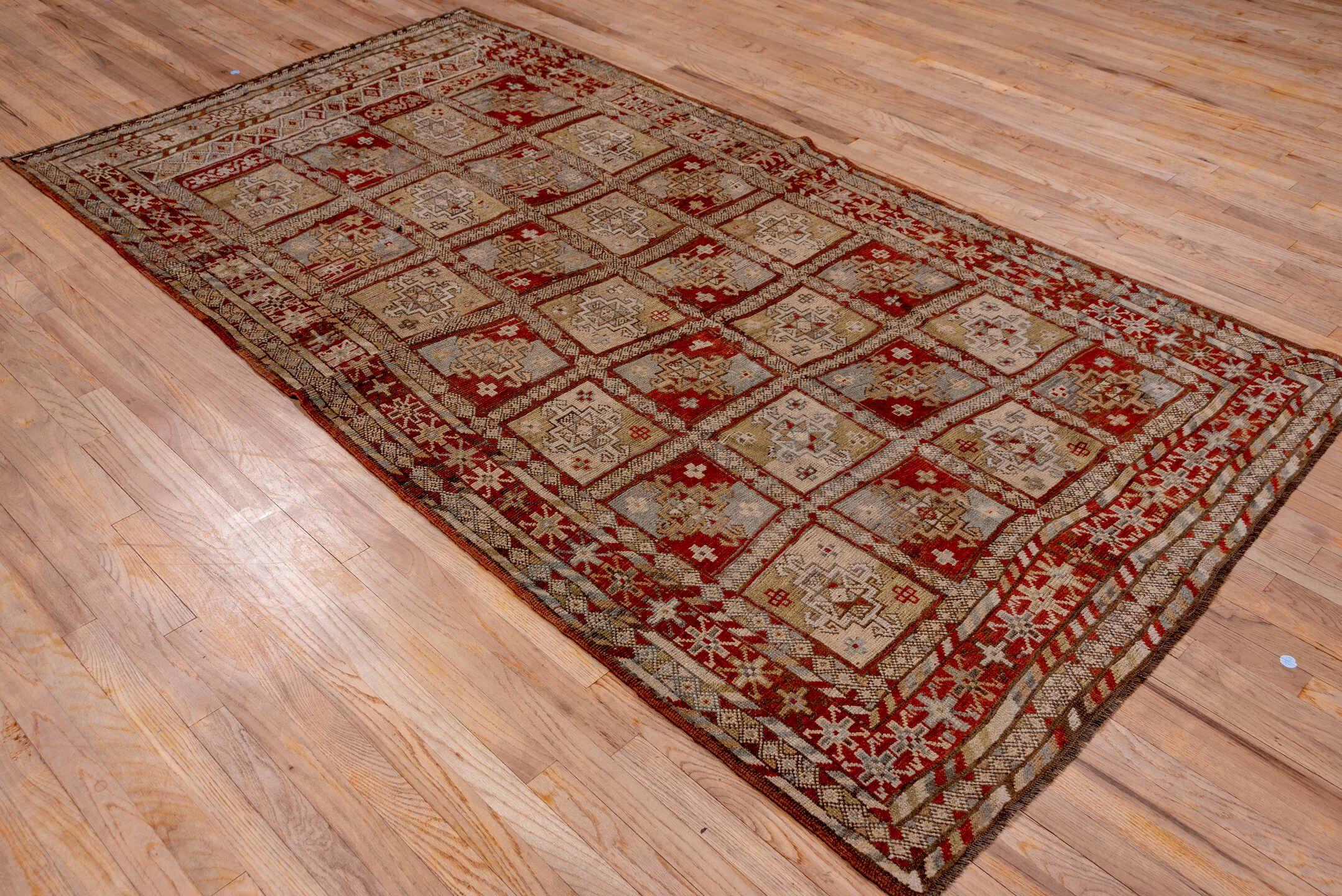 5' x 9' one-of-a-kind handmade antique NW Persian medium size rug. Color palette: taupe, rust, ivory, slate, brown, camel