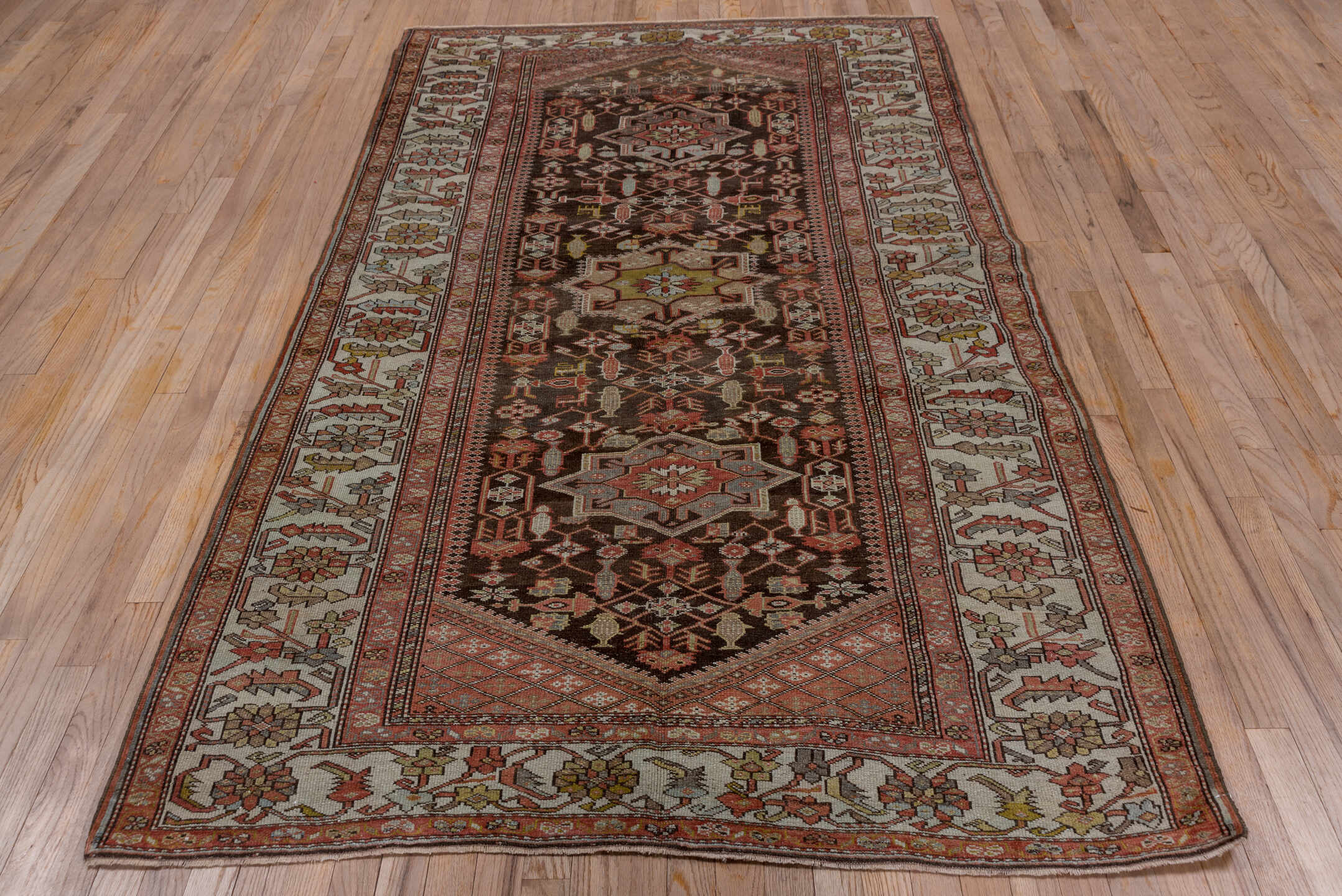 4' x 8' one-of-a-kind handmade antique Malayer rug. Color palette: brown, ivory, rust, camel, sage, soft blue, terracotta
