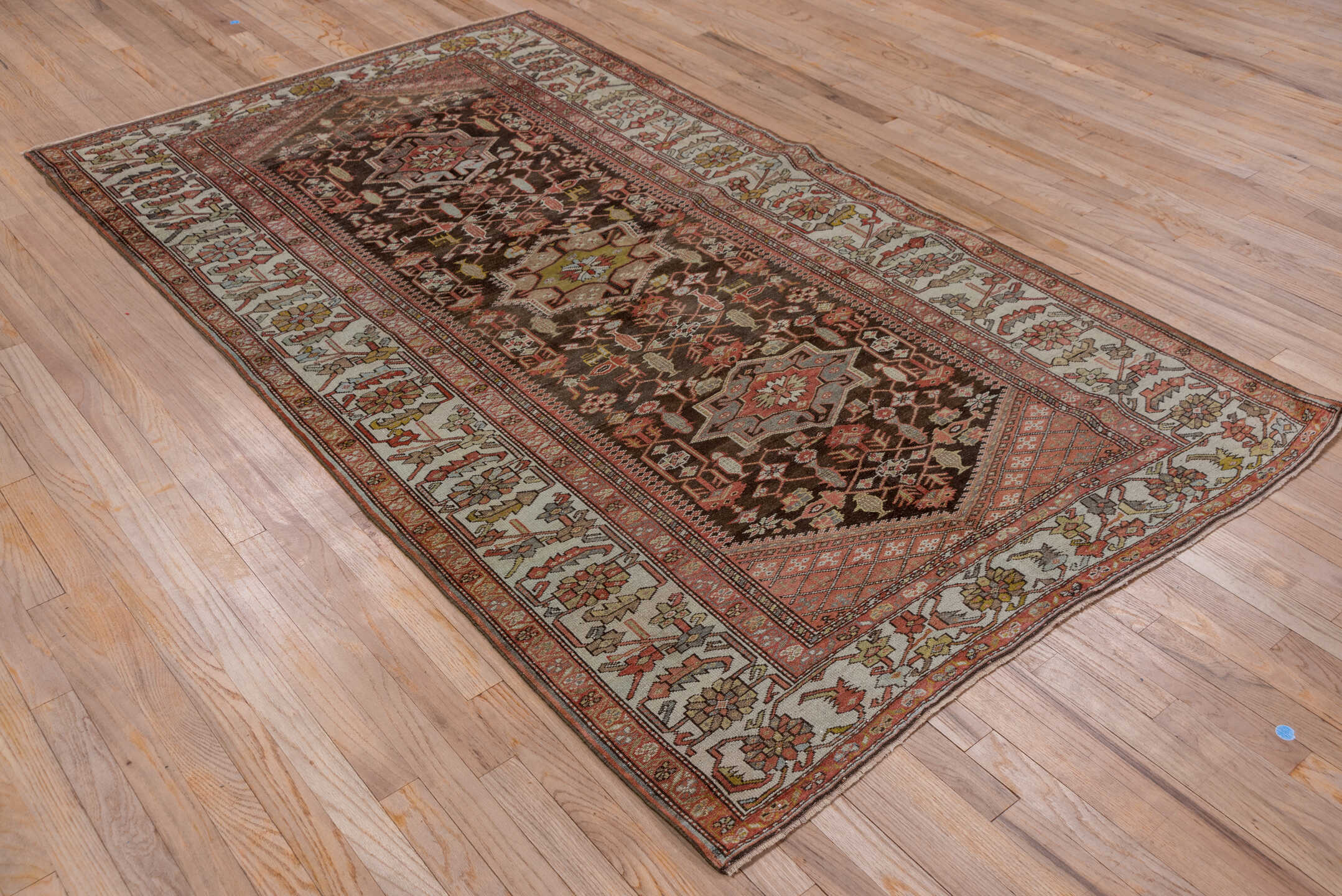 4' x 8' one-of-a-kind handmade antique Malayer rug. Color palette: brown, ivory, rust, camel, sage, soft blue, terracotta