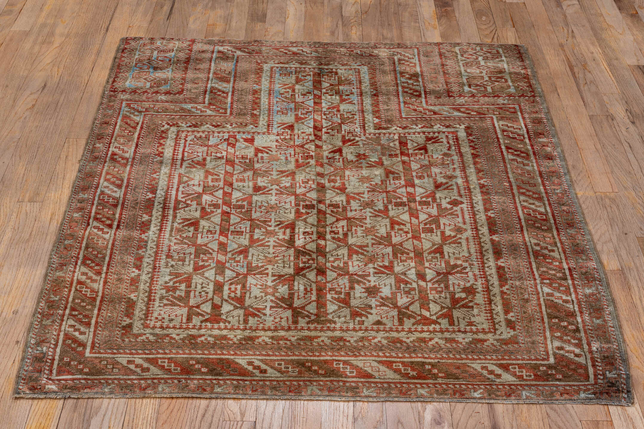 3' x 4' one-of-a-kind handmade antique Belouch small size rug. Color palette: rust, ivory, taupe, brown, terra cotta