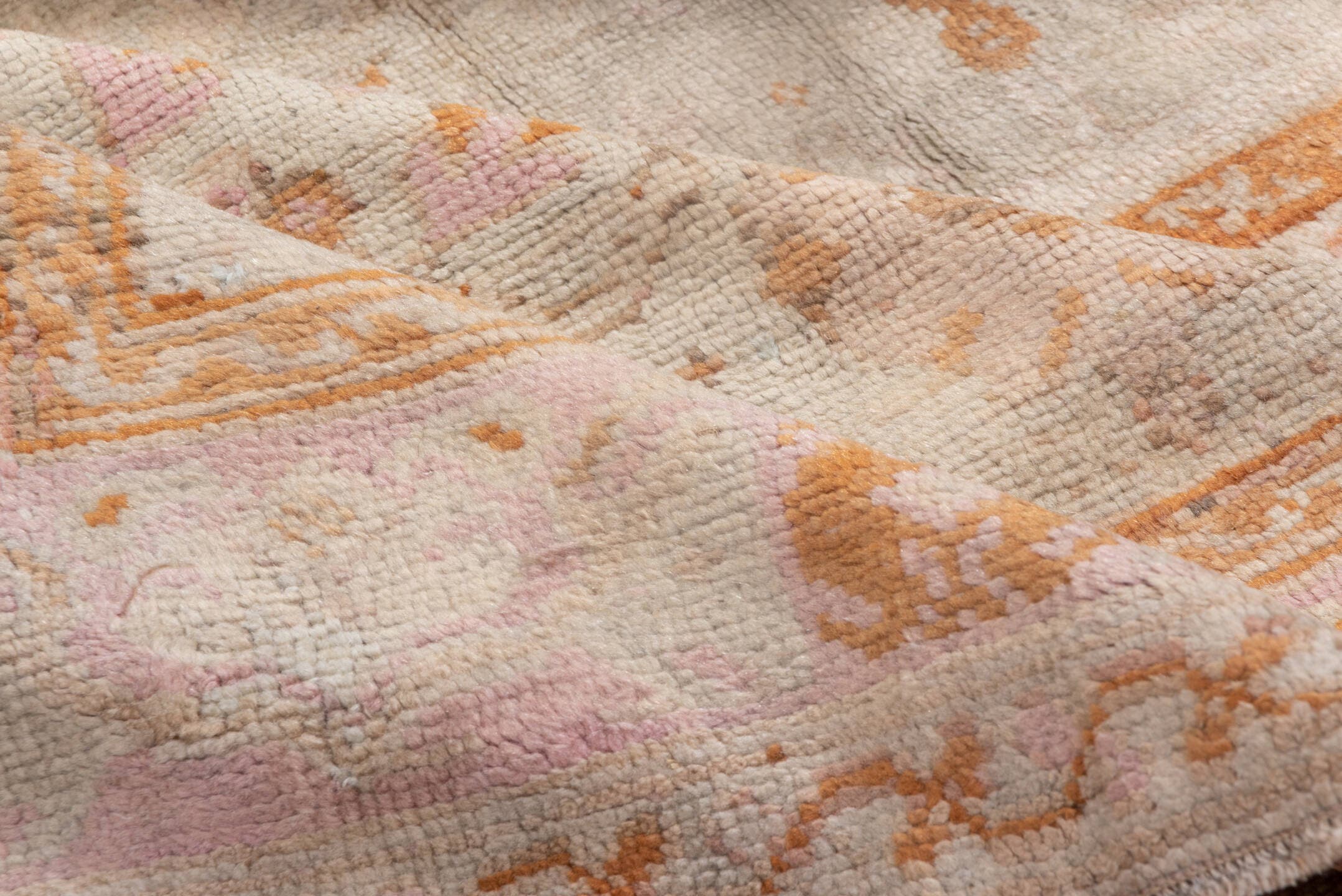 10' x 21' one-of-a-kind handmade antique Oushak rug. Color palette: ivory, blush, peach, taupe, camel, sage, pink