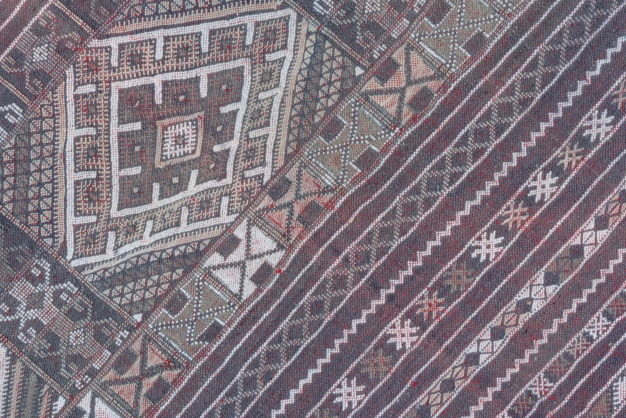 6' x 9' one-of-a-kind handmade vintage Jijim medium size rug. Color palette: taupe, brown, ivory, burgundy, rose, charcoal