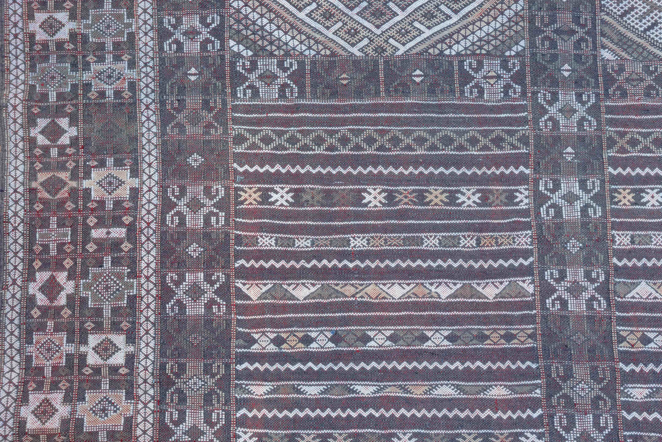 6' x 9' one-of-a-kind handmade vintage Jijim medium size rug. Color palette: taupe, brown, ivory, burgundy, rose, charcoal