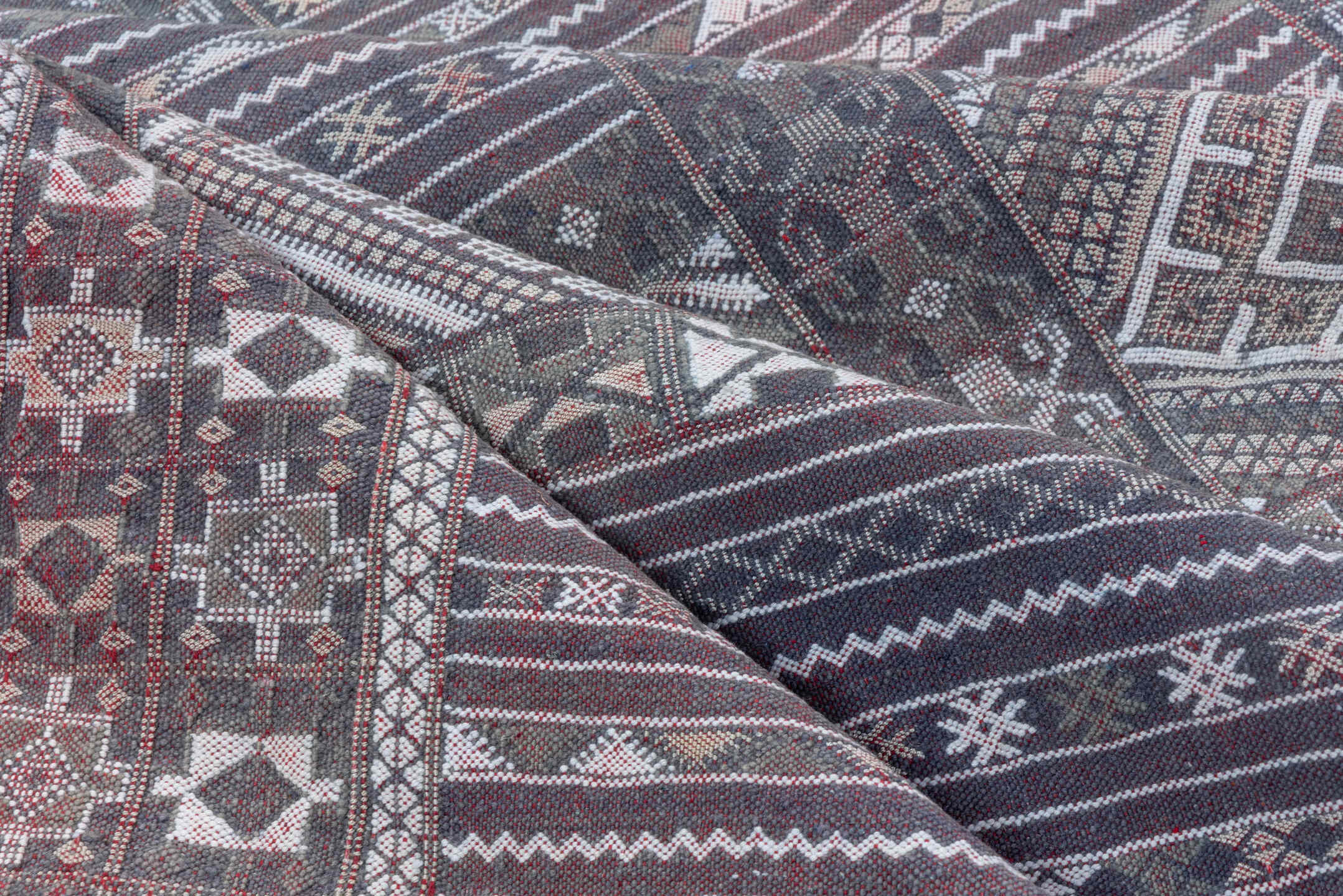 6' x 9' one-of-a-kind handmade vintage Jijim medium size rug. Color palette: taupe, brown, ivory, burgundy, rose, charcoal