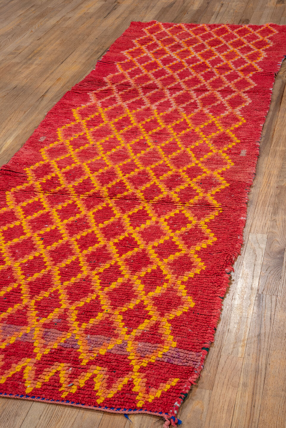 3' x 9' one-of-a-kind handmade vintage Rag Rug runner rug. Color palette: red, coral, gold, terra cotta, rose, terracotta