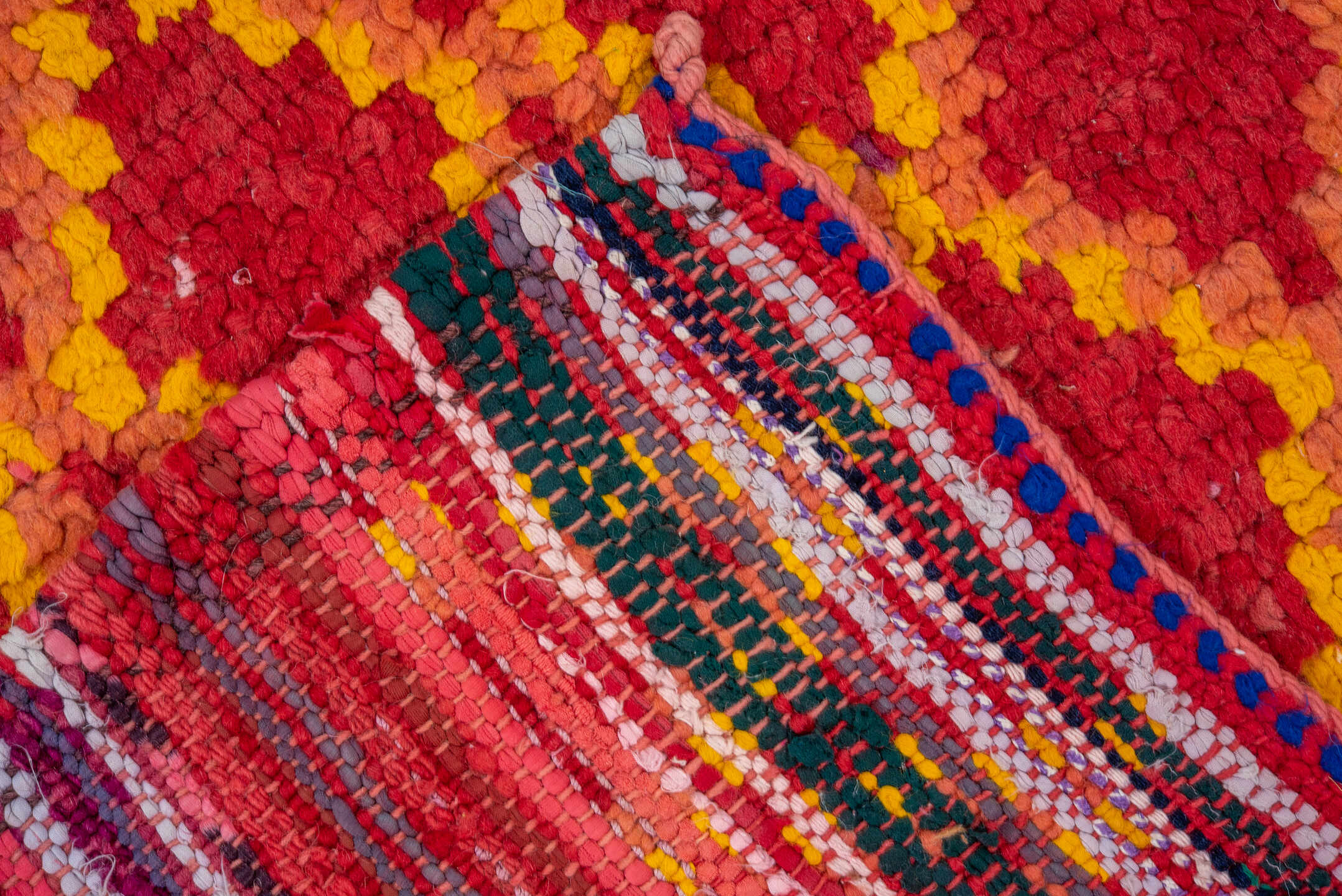 3' x 9' one-of-a-kind handmade vintage Rag Rug runner rug. Color palette: red, coral, gold, terra cotta, rose, terracotta